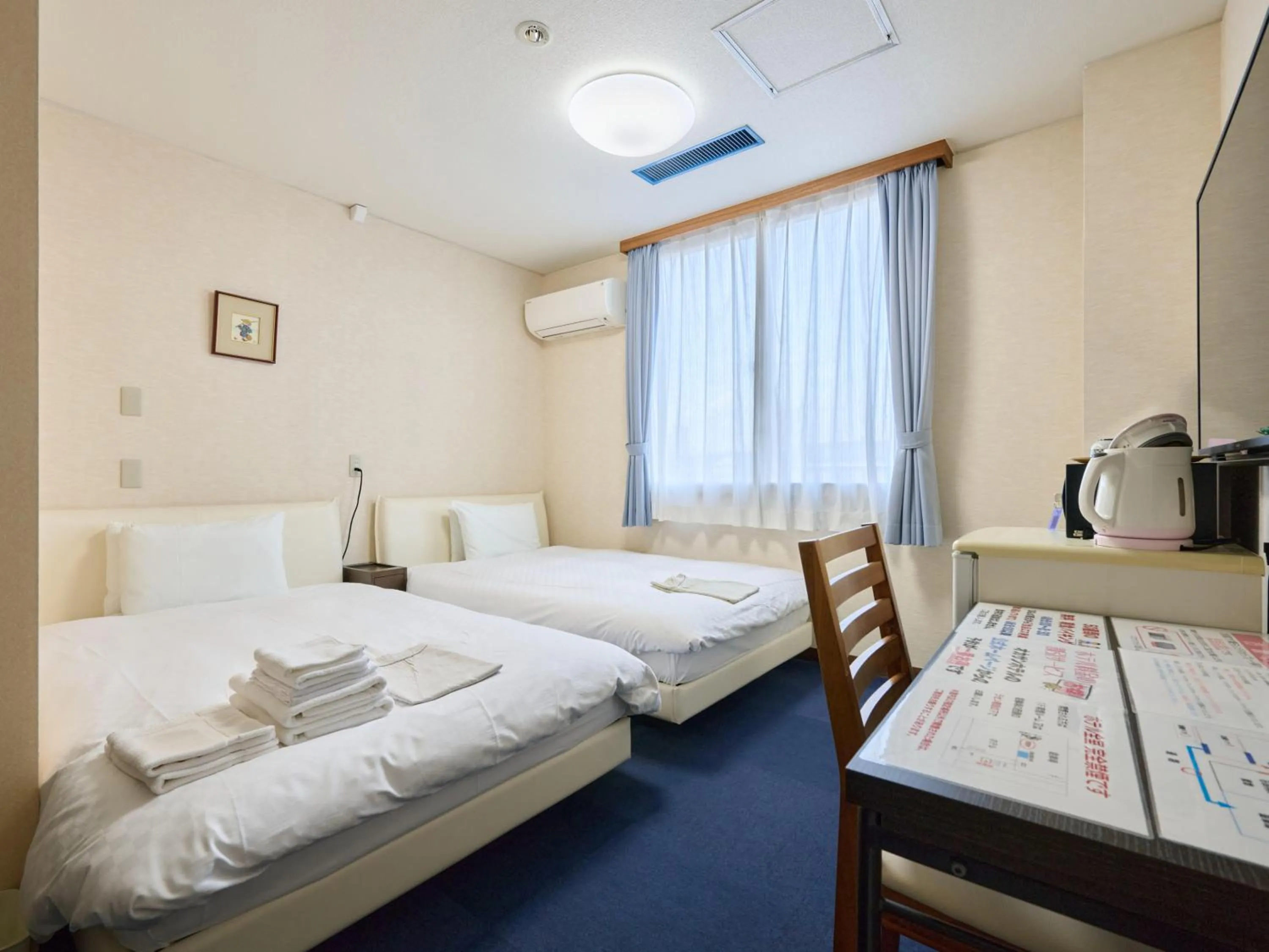 Photo of the whole room, Bed in Okasan Hotel