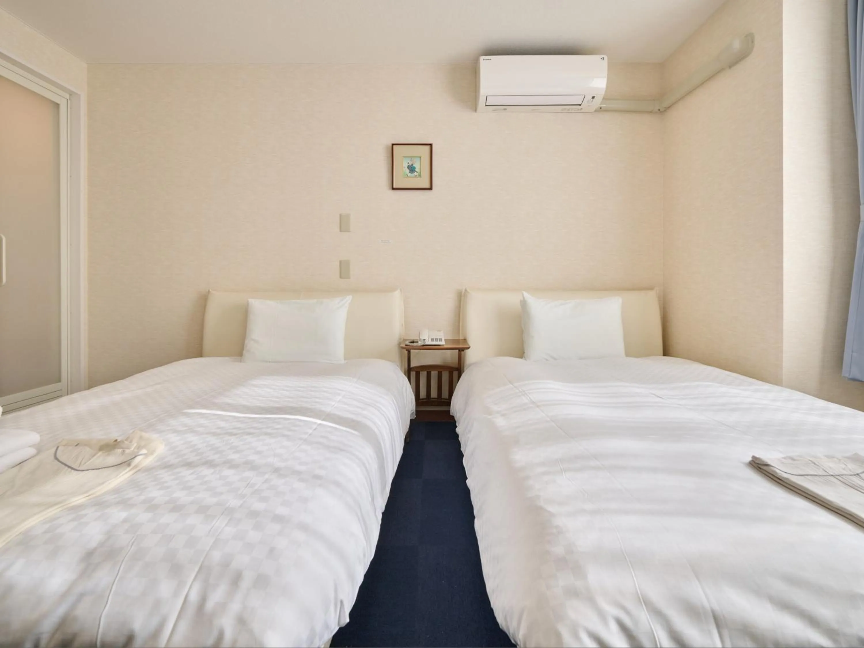 Photo of the whole room, Bed in Okasan Hotel