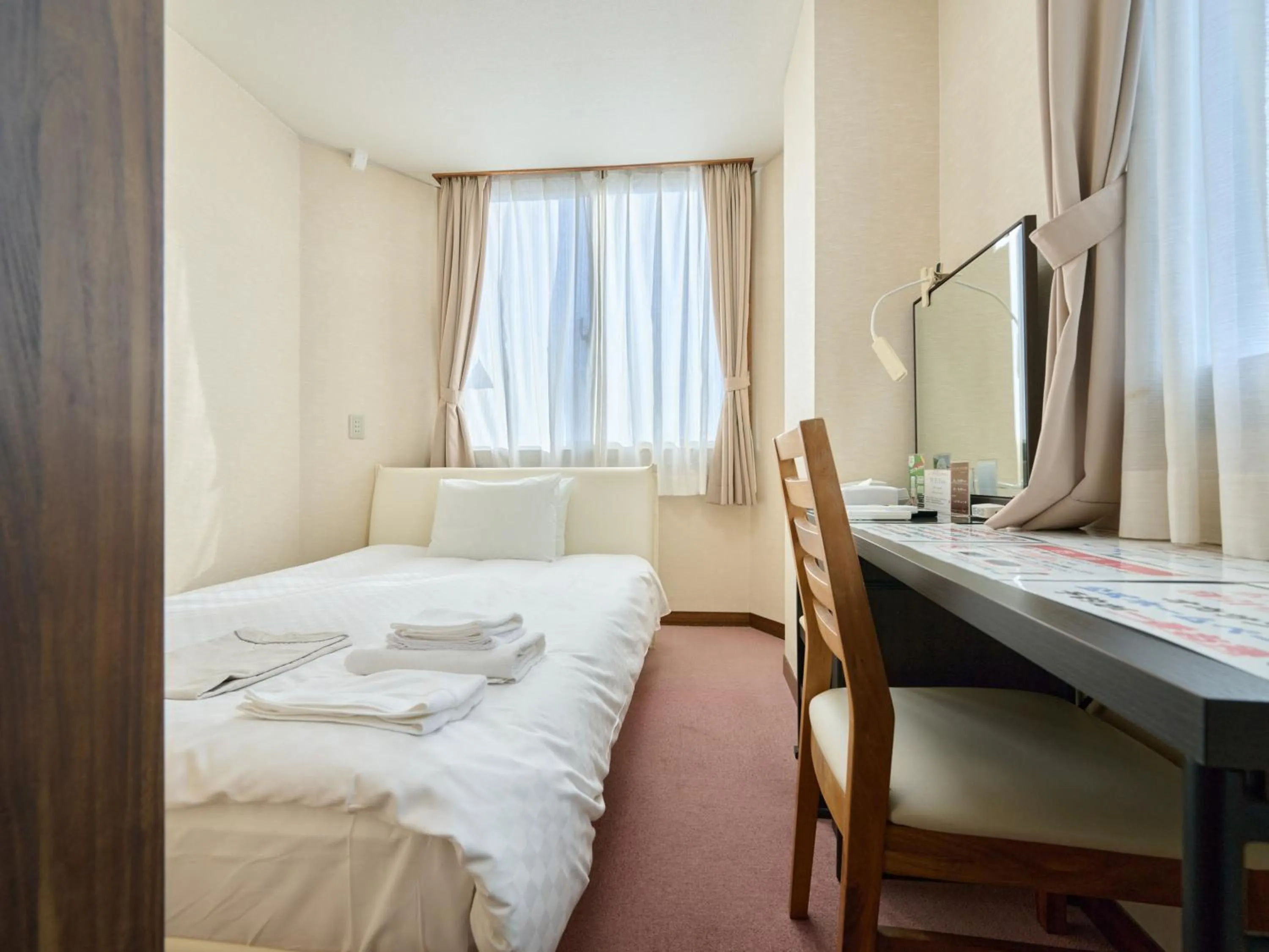 Photo of the whole room, Bed in Okasan Hotel