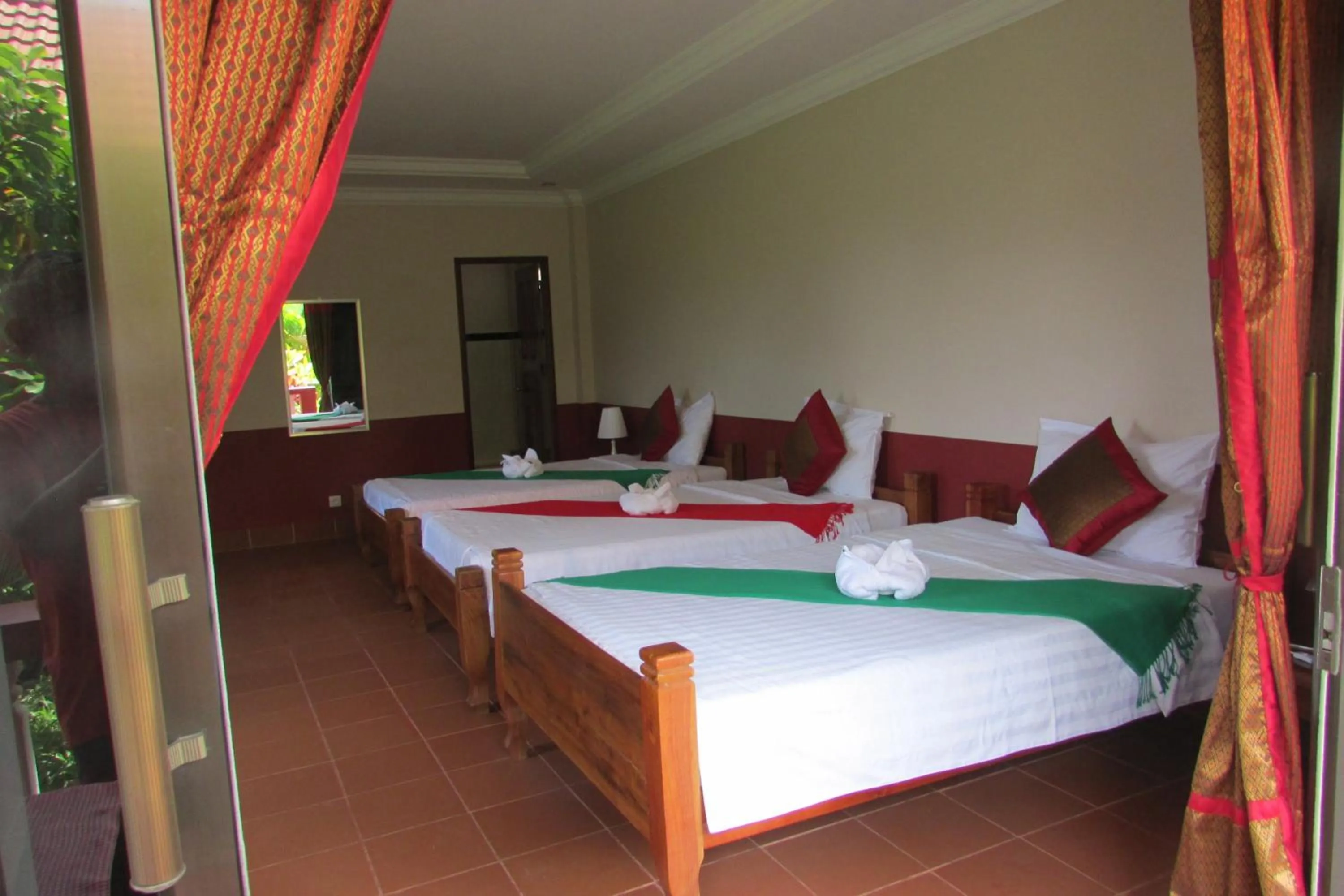 Photo of the whole room, Bed in Phoumrumduol Bungalow