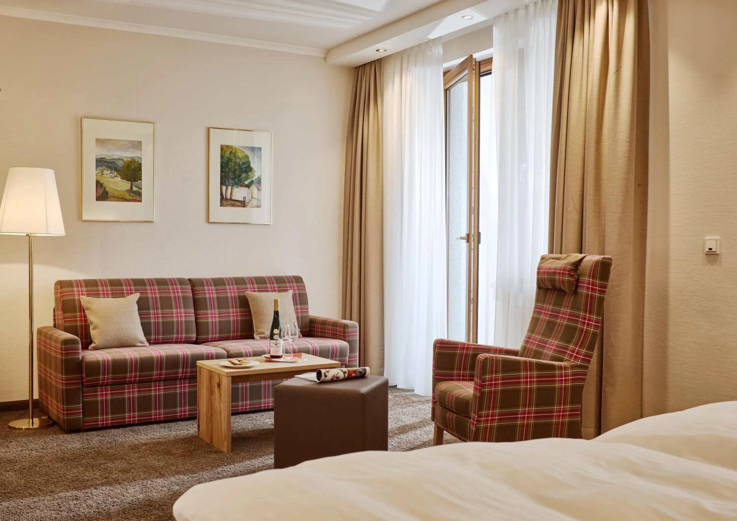 Seating area, Bed in Hotel Weis