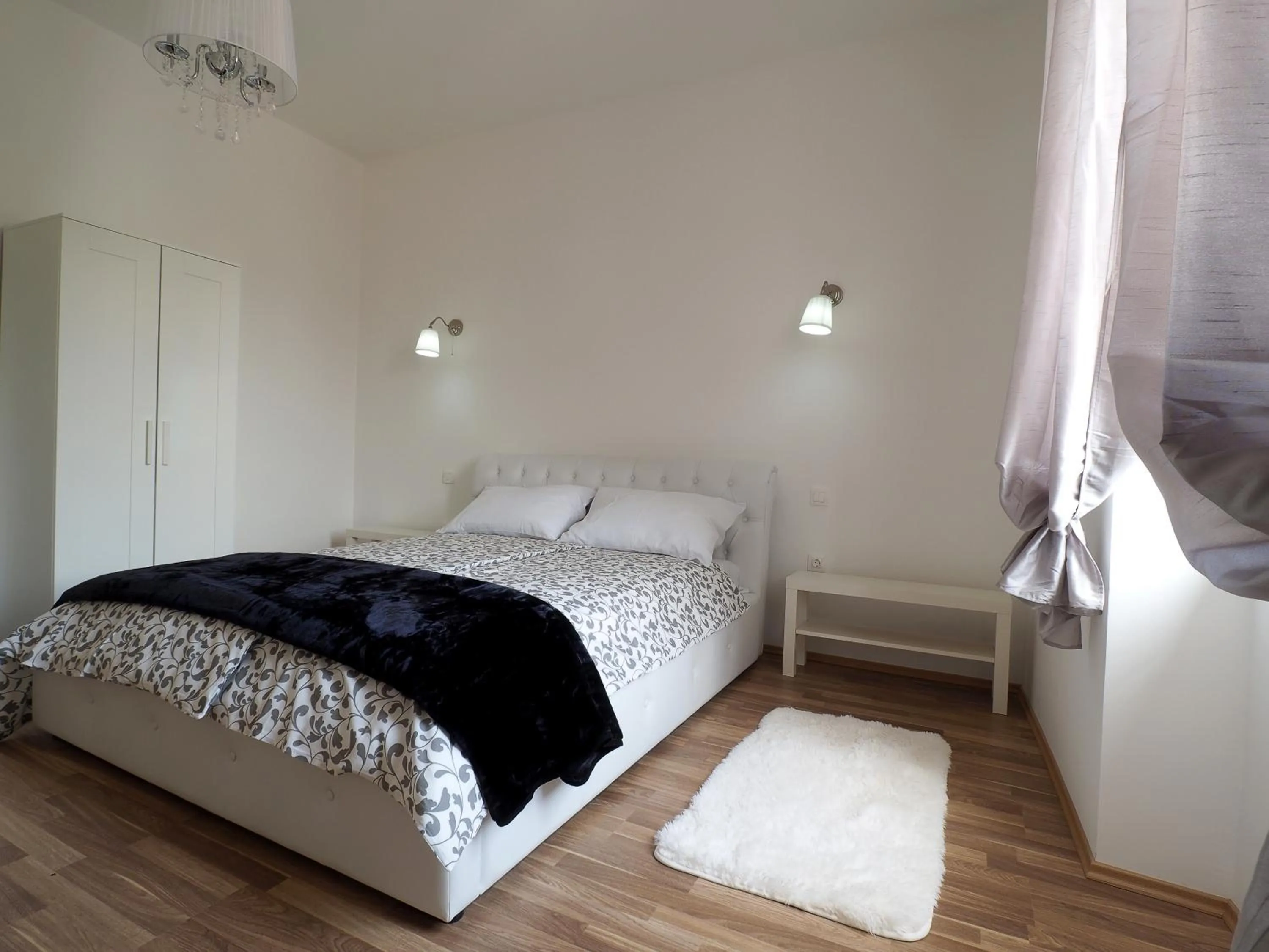 Bed in Captain Emo City Apartments