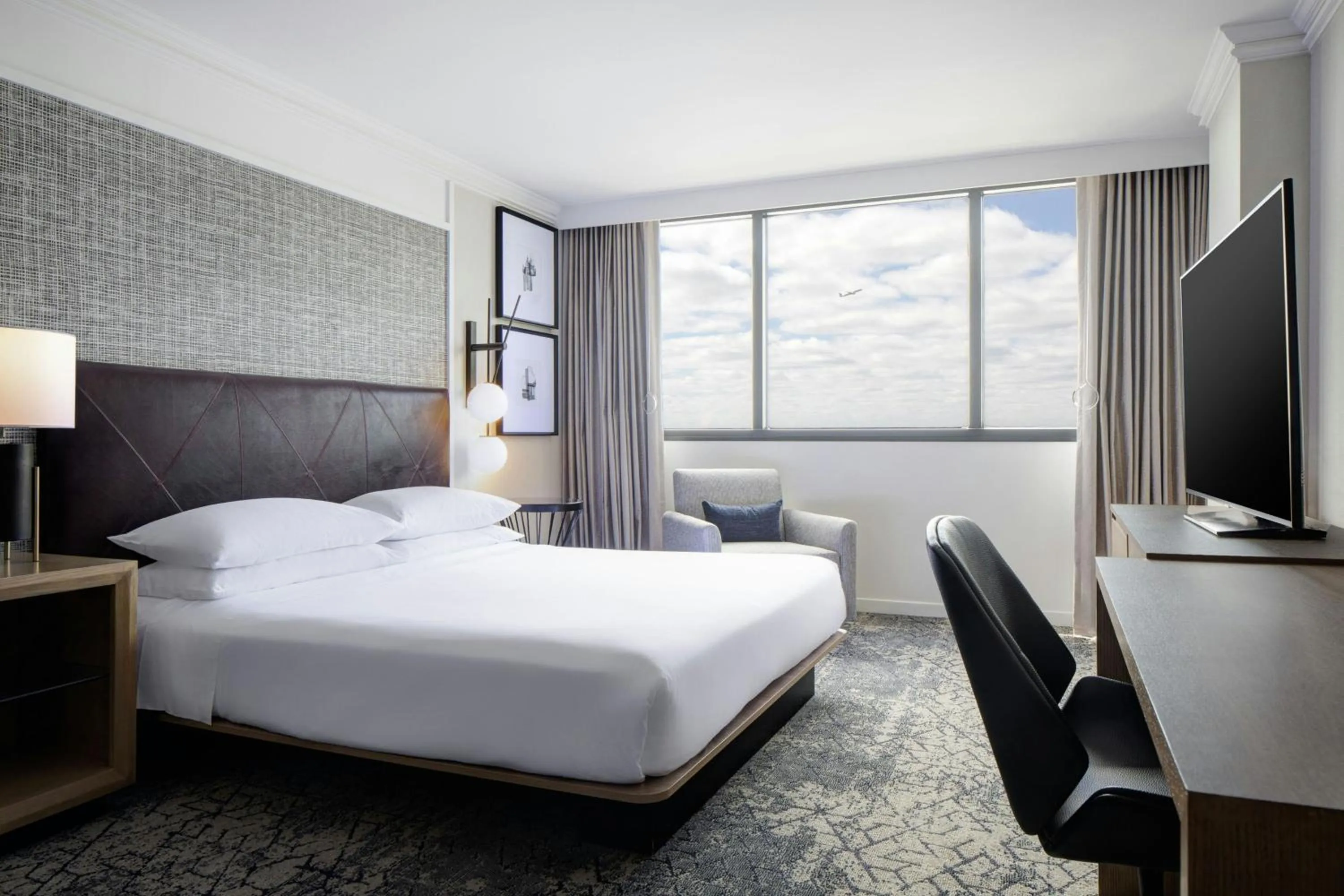 Photo of the whole room, Bed in Sheraton DFW Airport Hotel