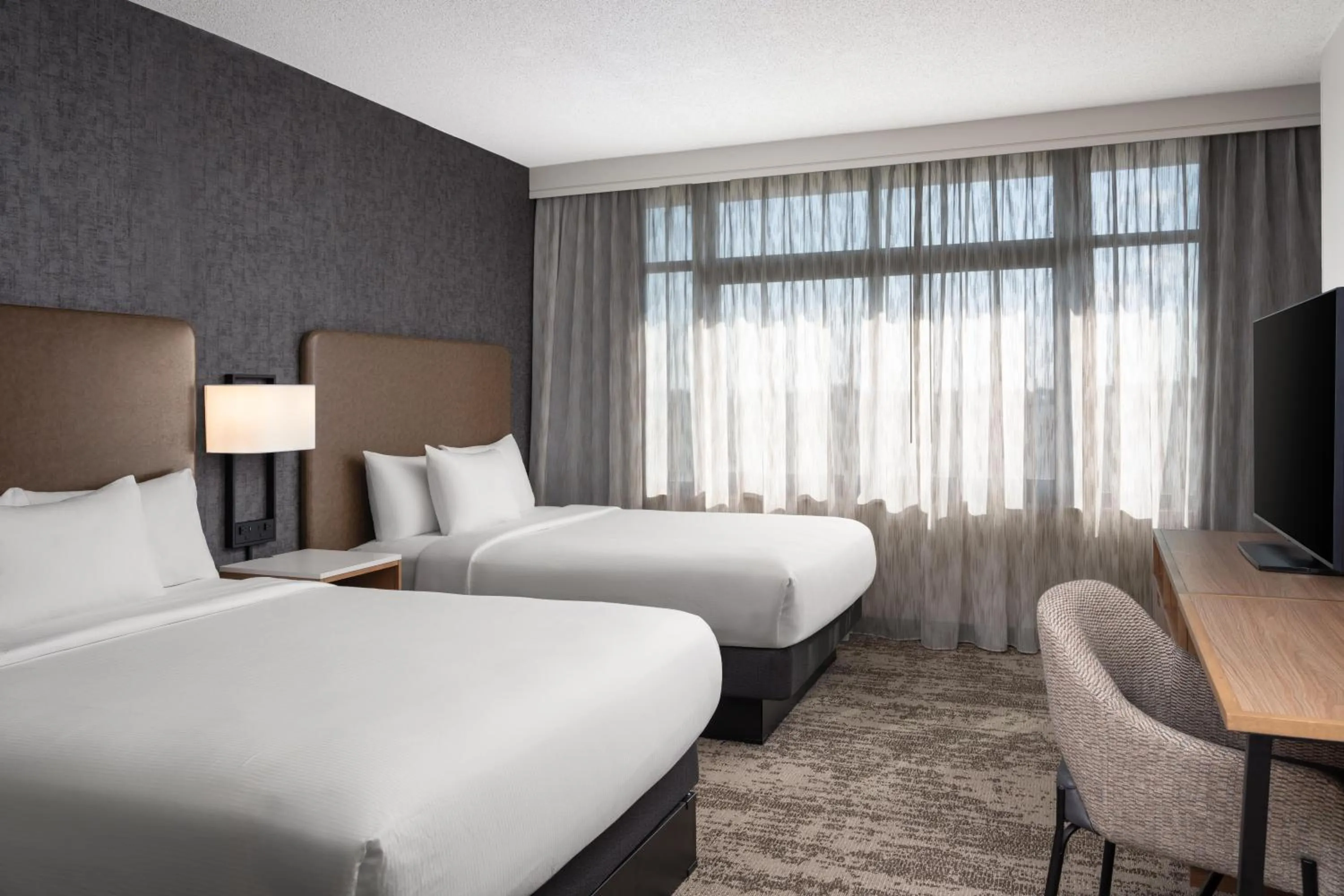 Bed in Embassy Suites by Hilton at Hot Springs Convention Center