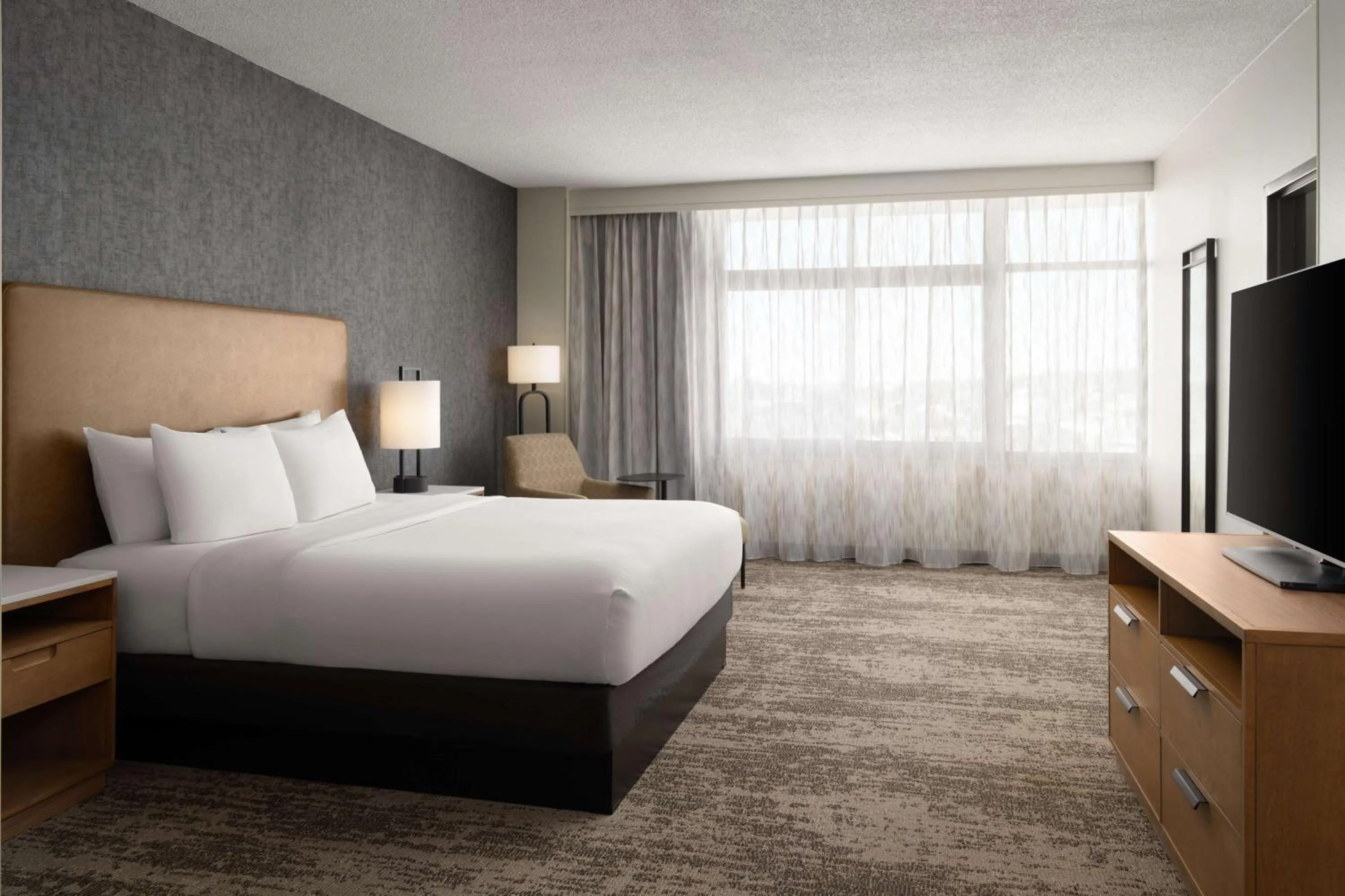 Bed in Embassy Suites by Hilton at Hot Springs Convention Center