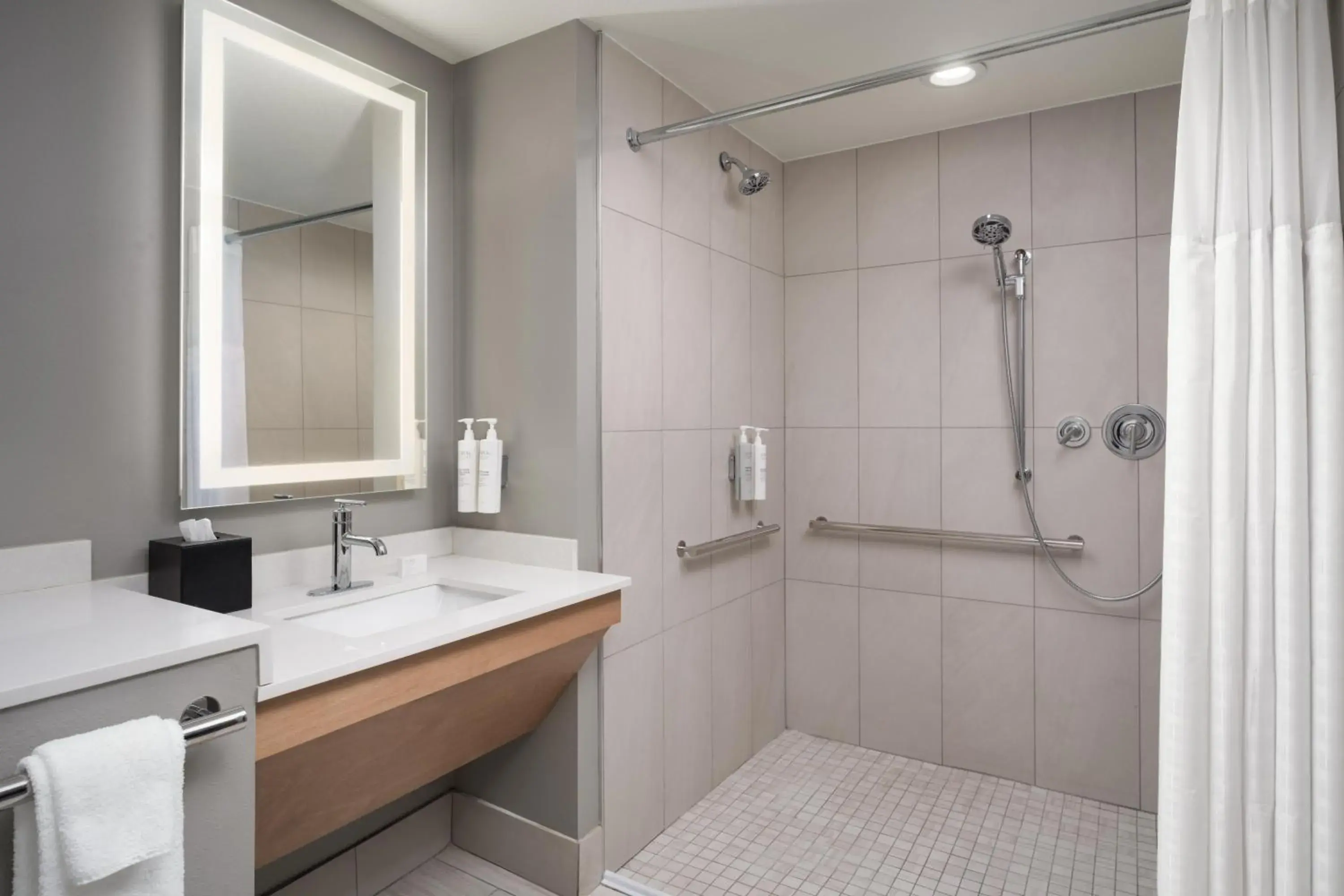 Bathroom in Embassy Suites by Hilton at Hot Springs Convention Center Bathroom in Embassy Suites by Hilton at Hot Springs Convention Center