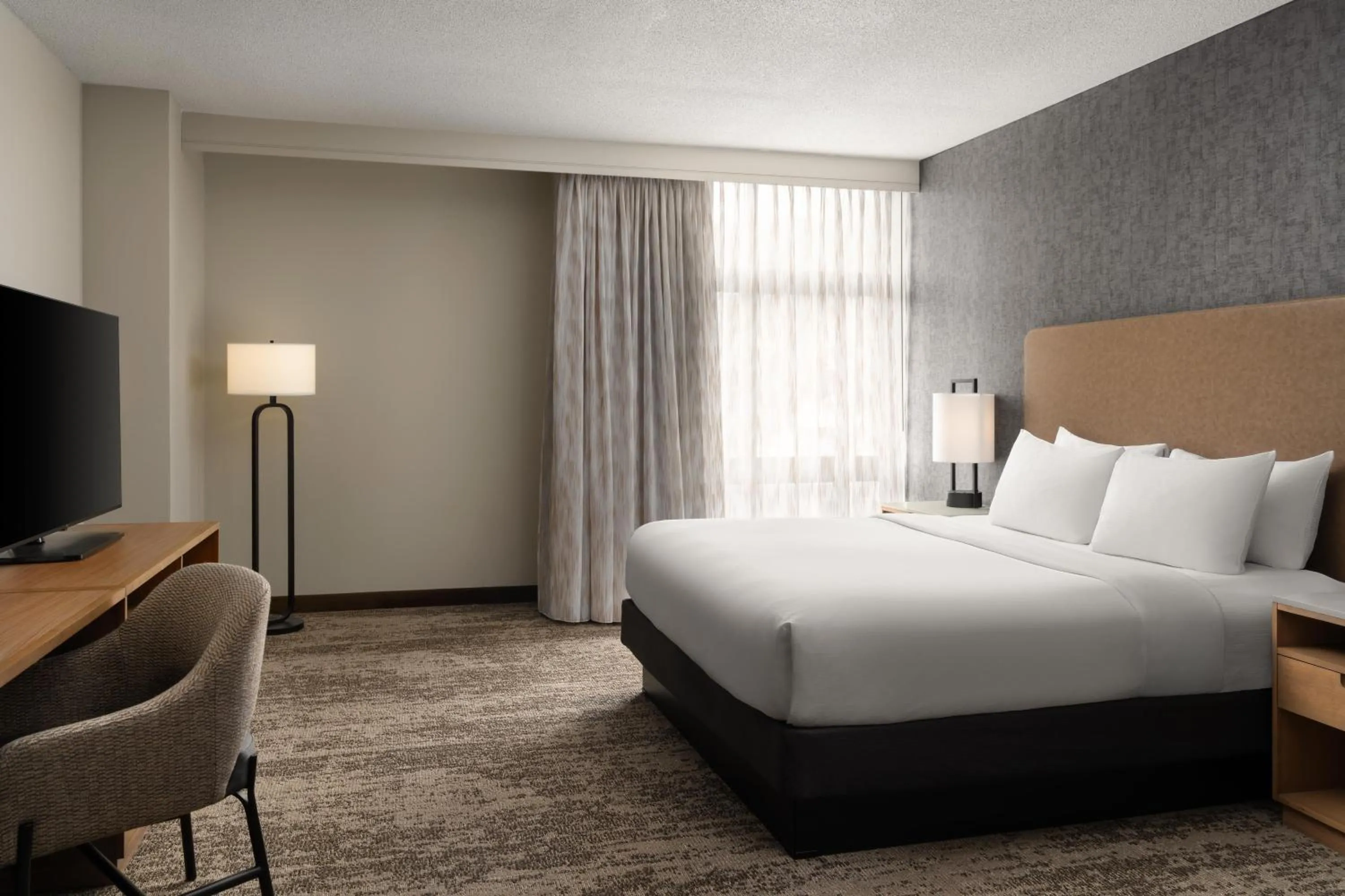 Bed in Embassy Suites by Hilton at Hot Springs Convention Center