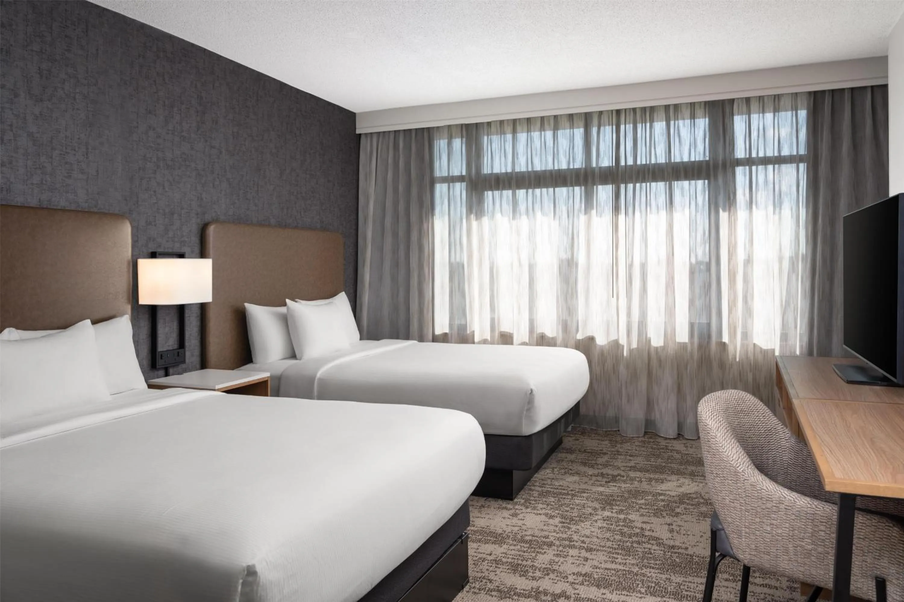 Bed in Embassy Suites by Hilton at Hot Springs Convention Center