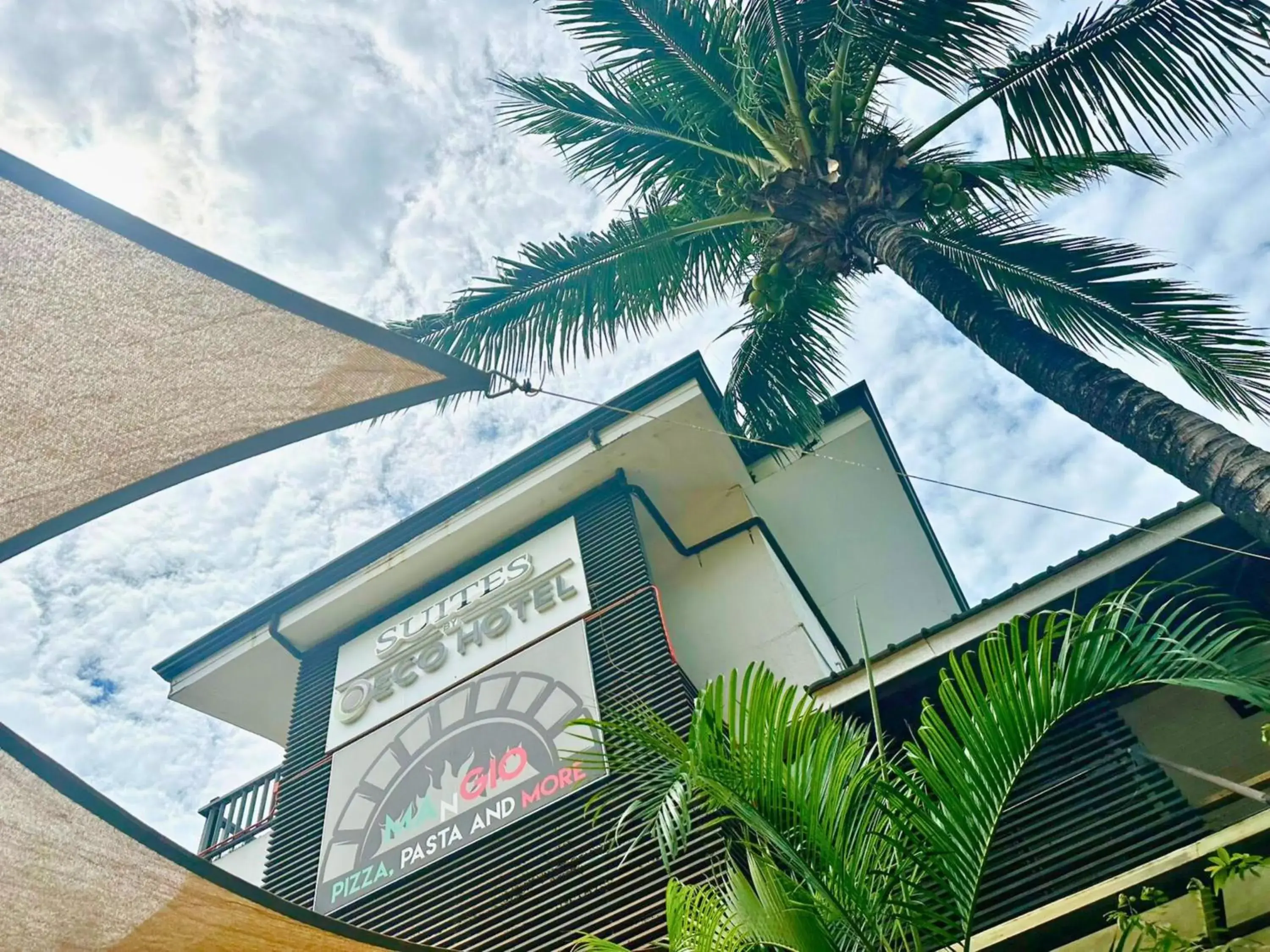 Property building in Suites by Eco Hotels Property building in Suites by Eco Hotels