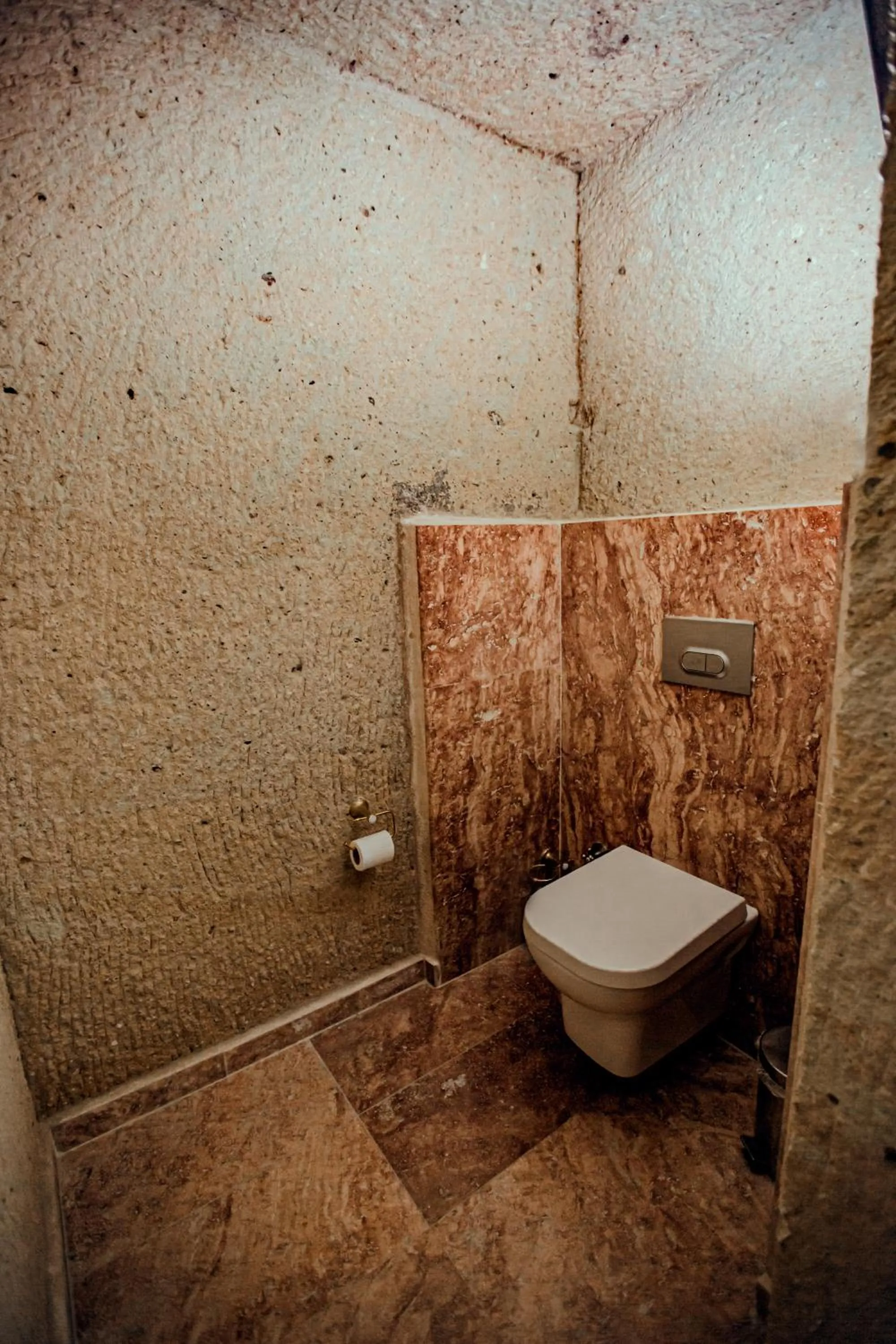 Toilet in Oread Cave Suites