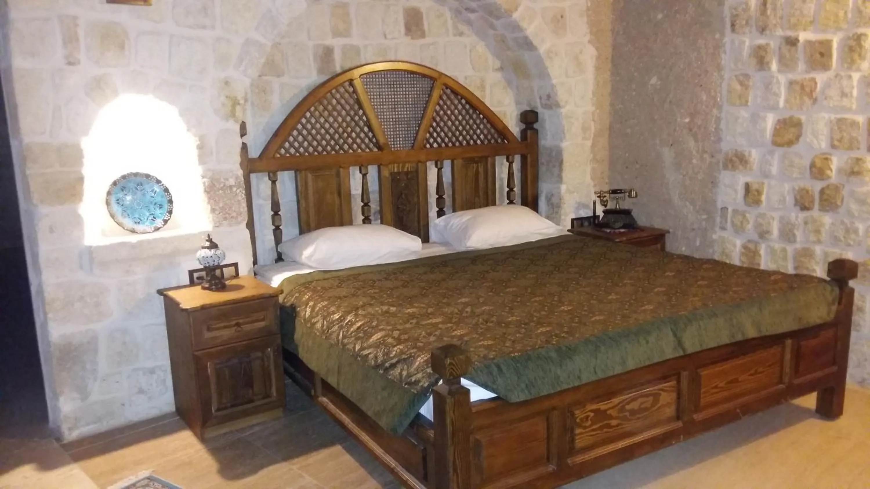 Bed in Oread Cave Suites