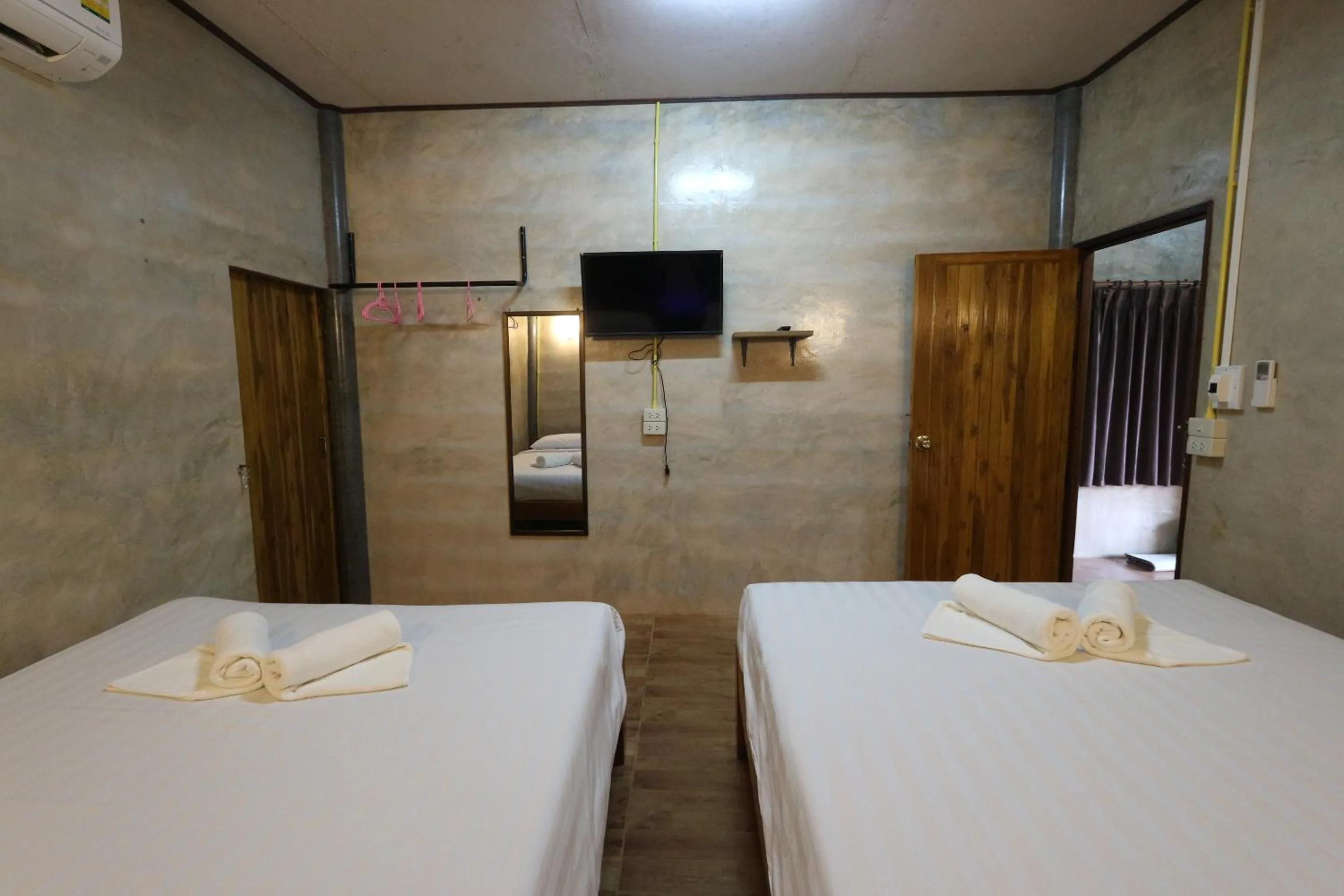 Bed in Baan Khue Wieng Resort