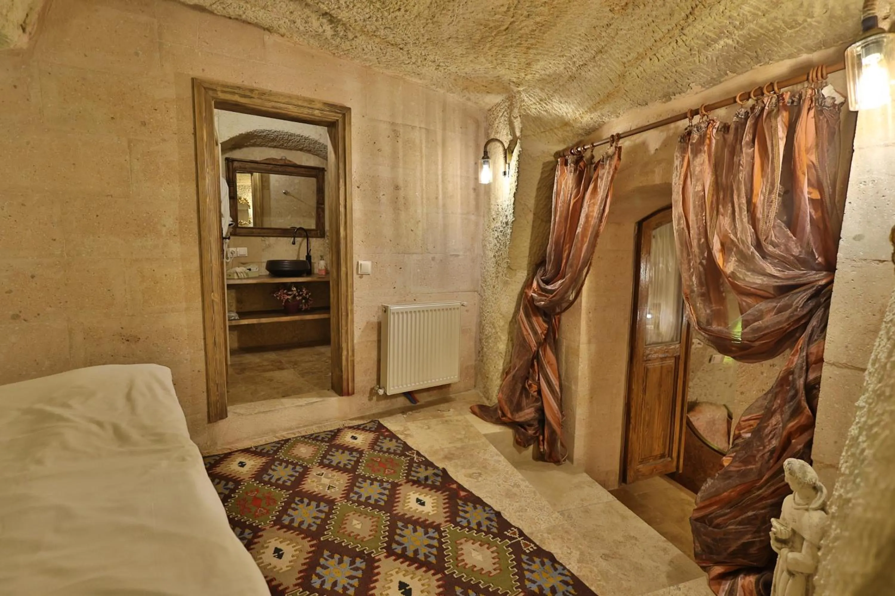 Photo of the whole room, Bed in Demisos Caves Hotel