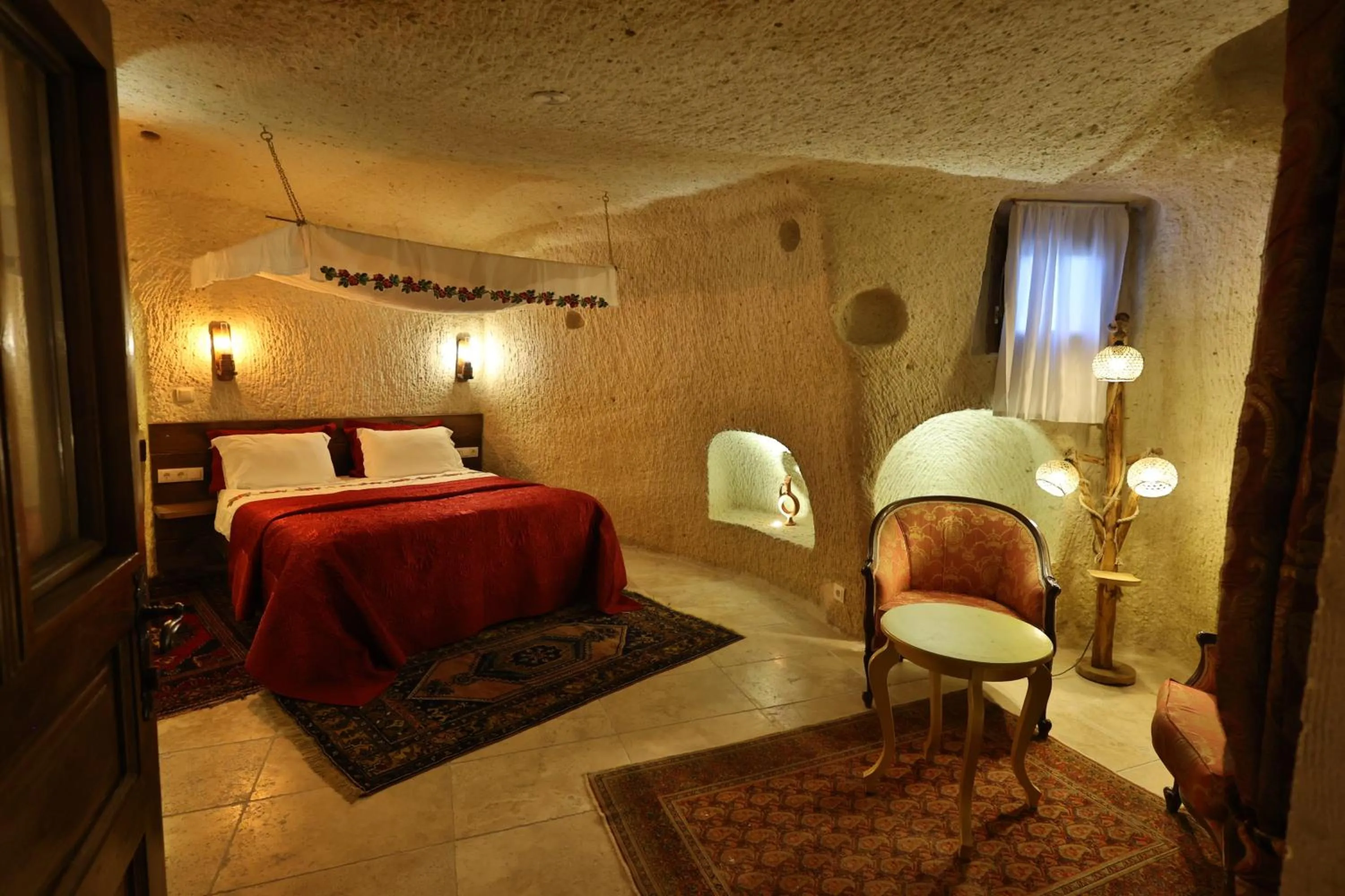 Photo of the whole room, Bed in Demisos Caves Hotel