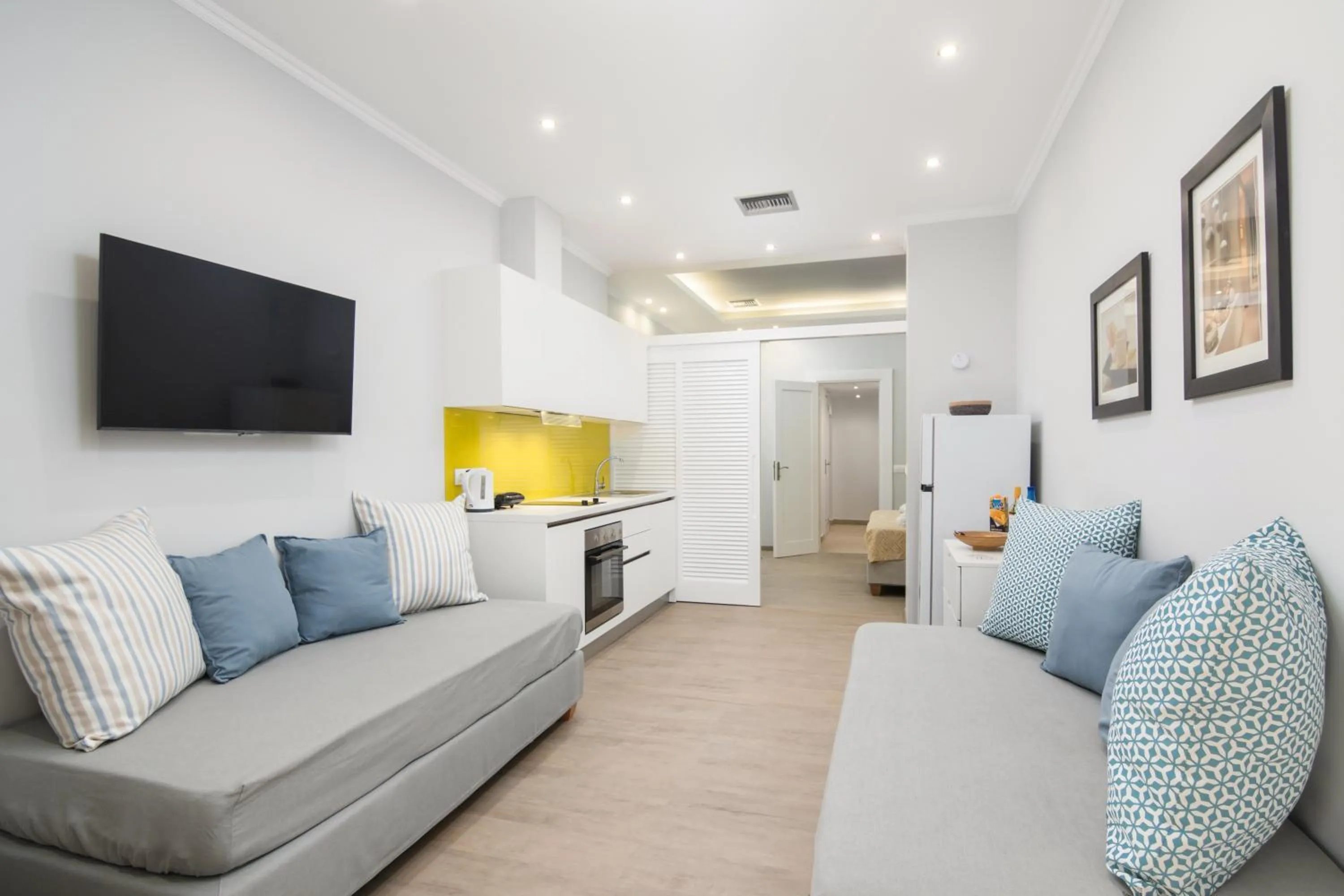Bed, Seating Area in Helion Apartments