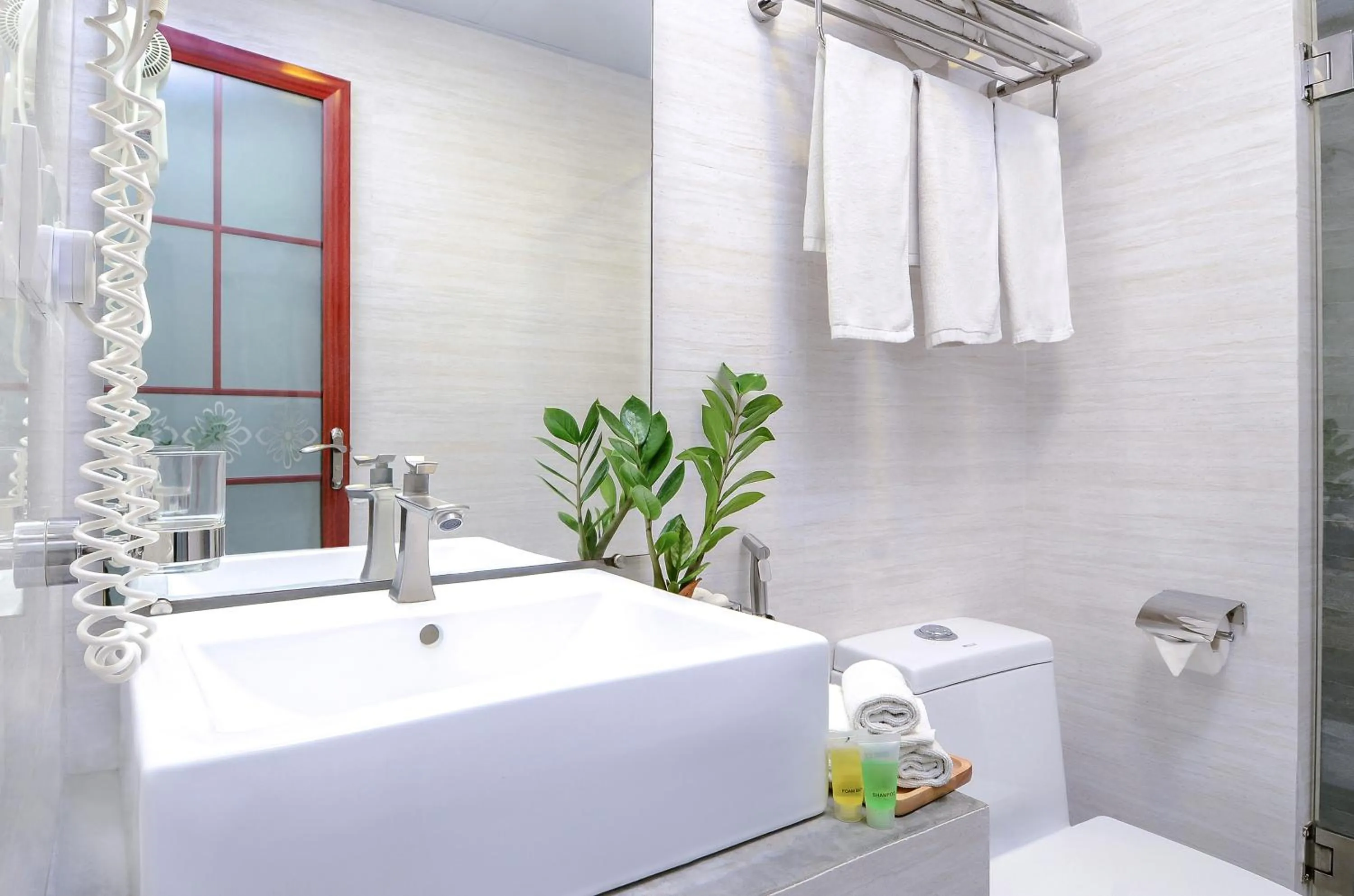 Toilet in Triton Beach Hotel & Spa