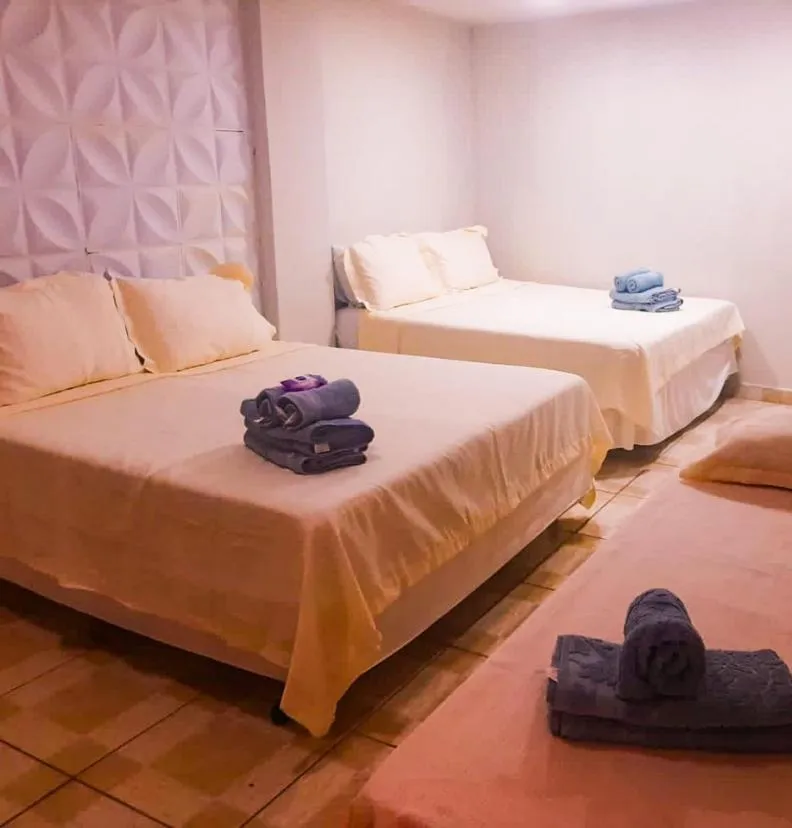 Bed in Pousada Lilás