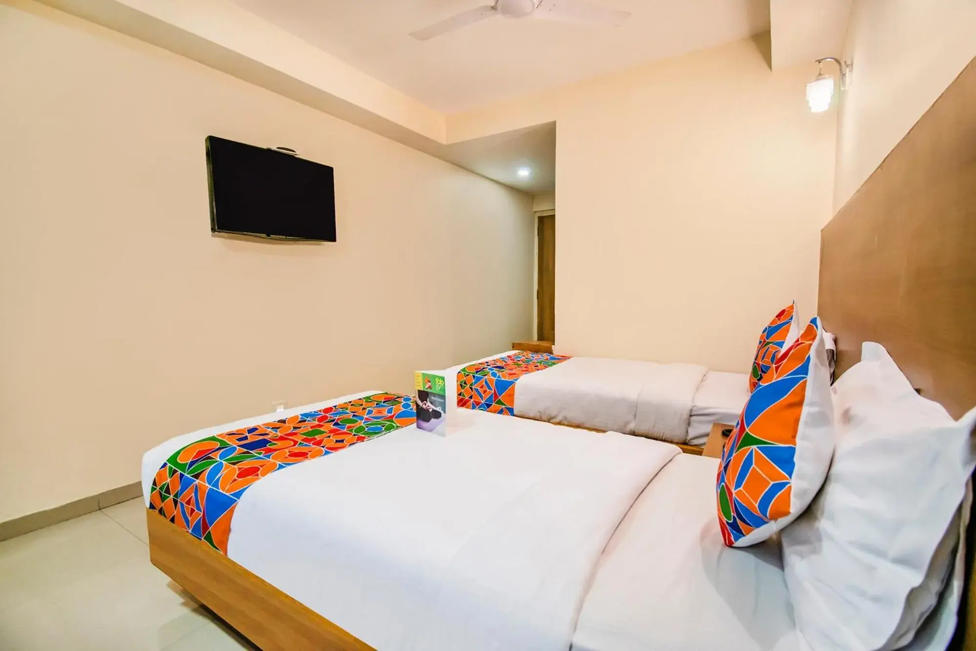 Bed in FabHotel Jansi Deluxe - Nr Gandhipuram Bus stand Bed in FabHotel Jansi Deluxe - Nr Gandhipuram Bus stand