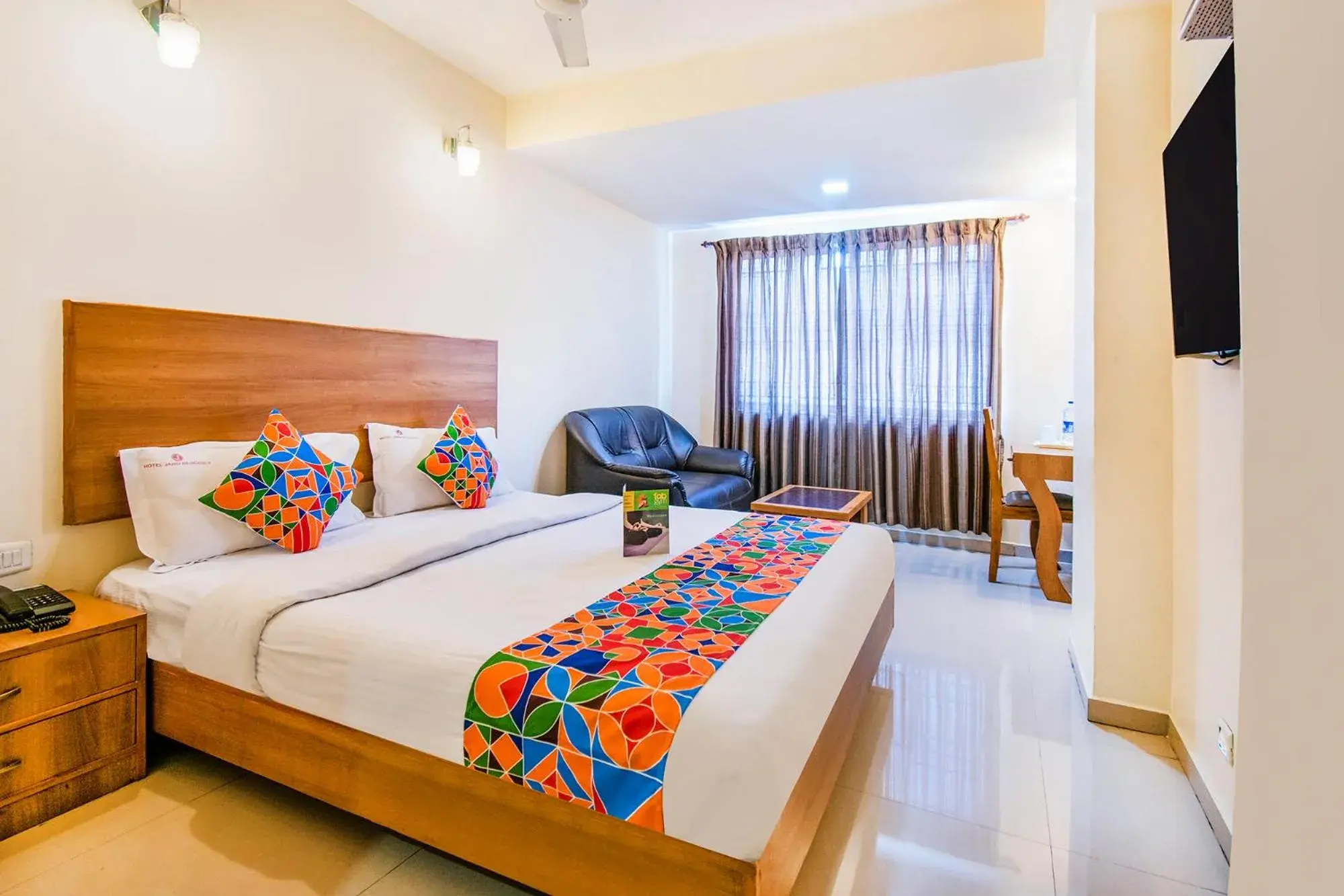 Bed in FabHotel Jansi Deluxe - Nr Gandhipuram Bus stand Bed in FabHotel Jansi Deluxe - Nr Gandhipuram Bus stand