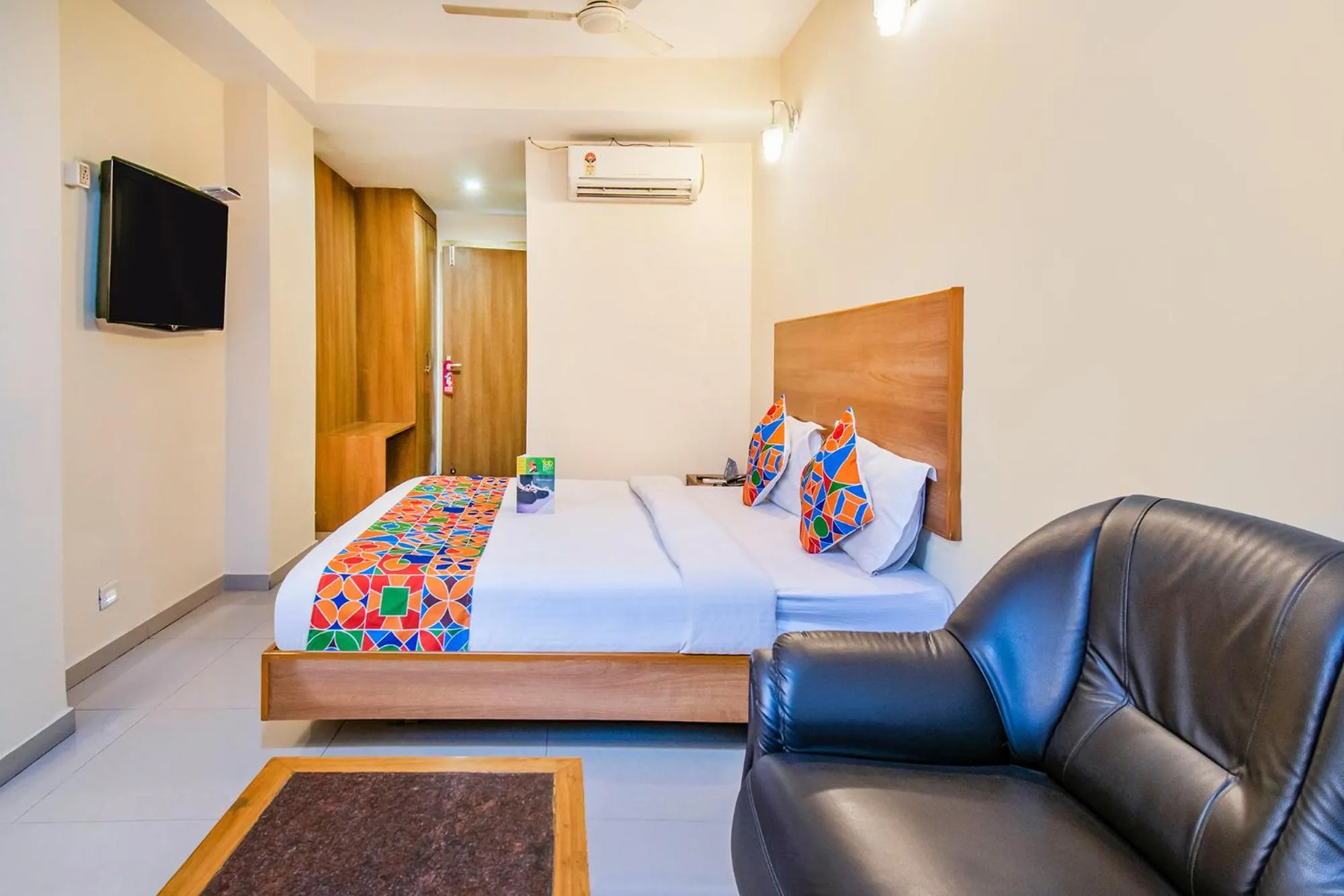 Bed in FabHotel Jansi Deluxe - Nr Gandhipuram Bus stand