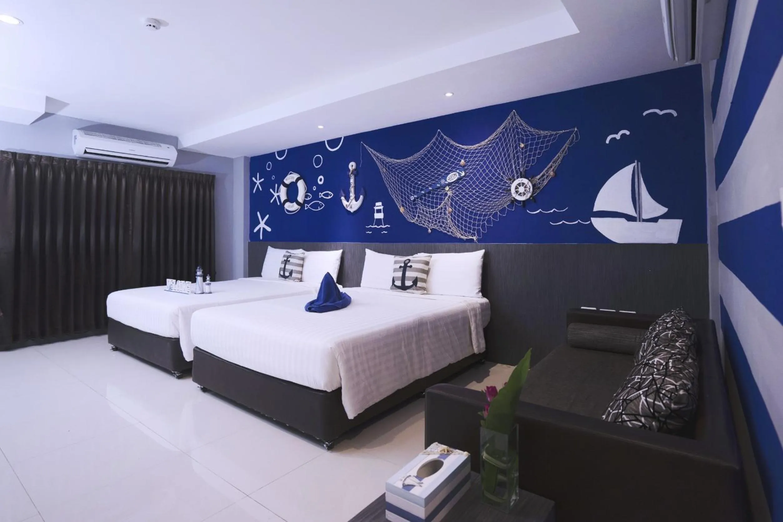 Photo of the whole room, Bed in FX Hotel Pattaya