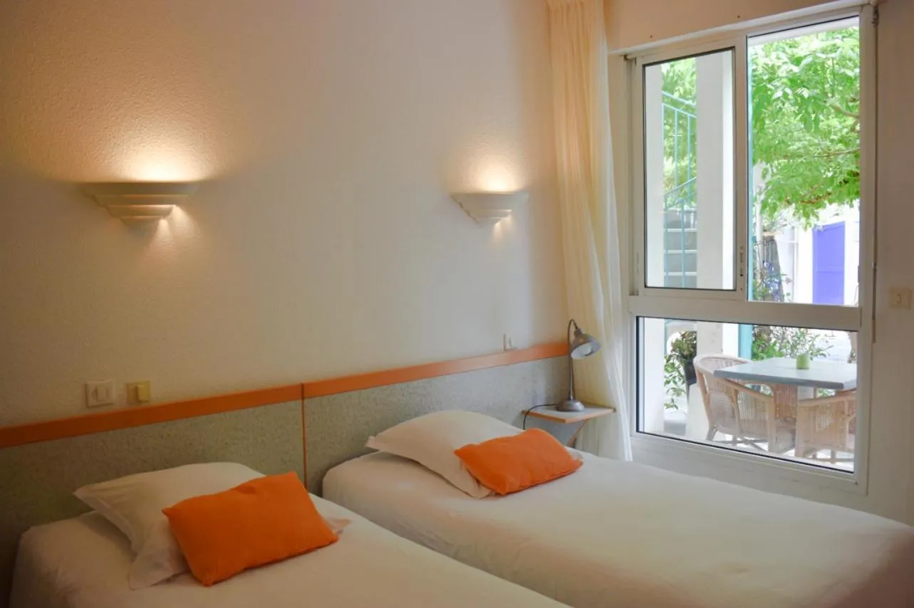 Bed in Hôtel Orange Marine