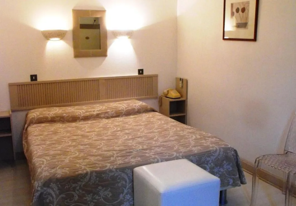 Bed in Logis Hôtel Restaurant Les Capucins