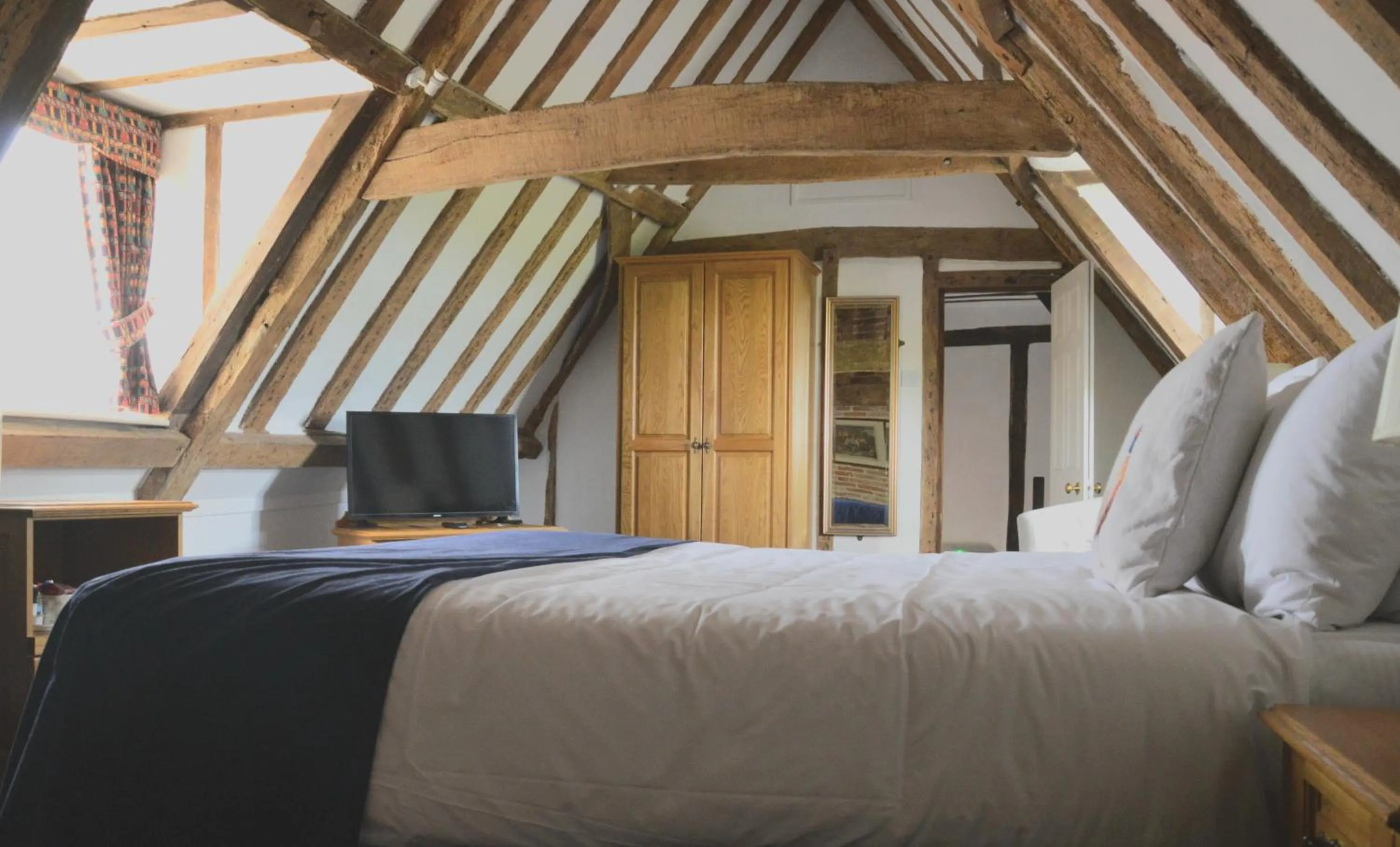 Bed in The Old Ram Coaching Inn