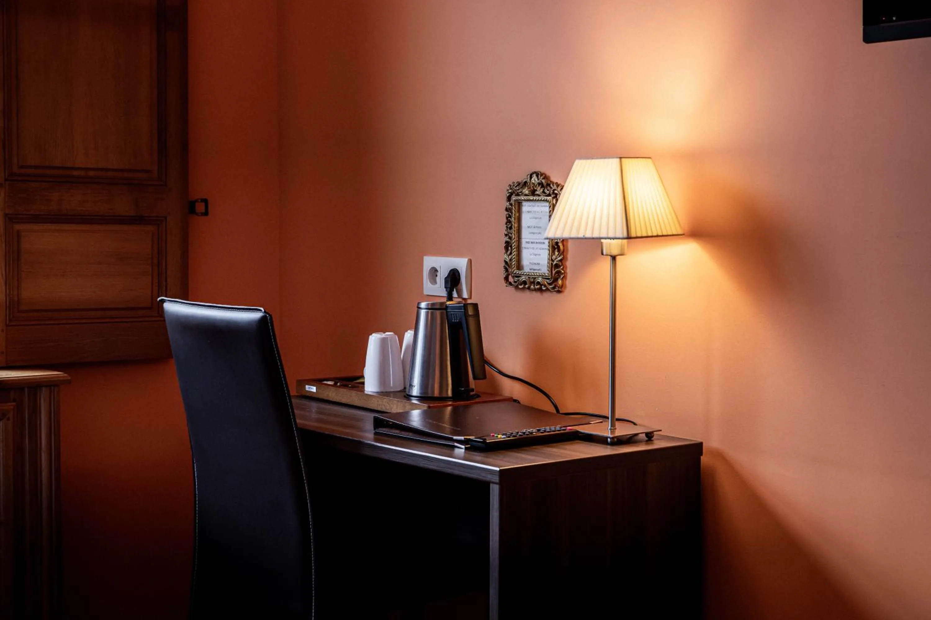 Bedroom in Logis Hotel La Diligence