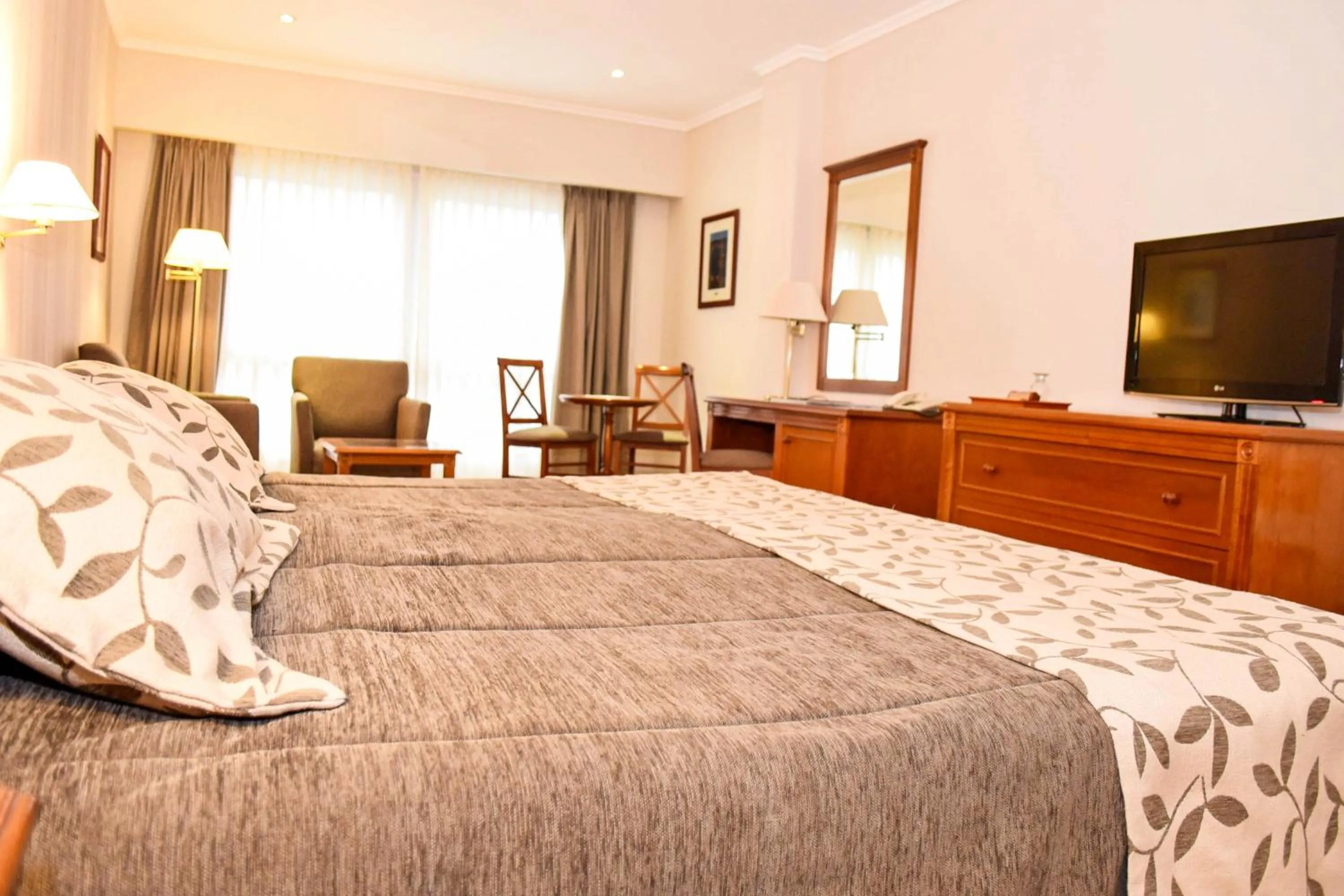 Bed in Howard Johnson Rio Ceballos Hotel y Casino