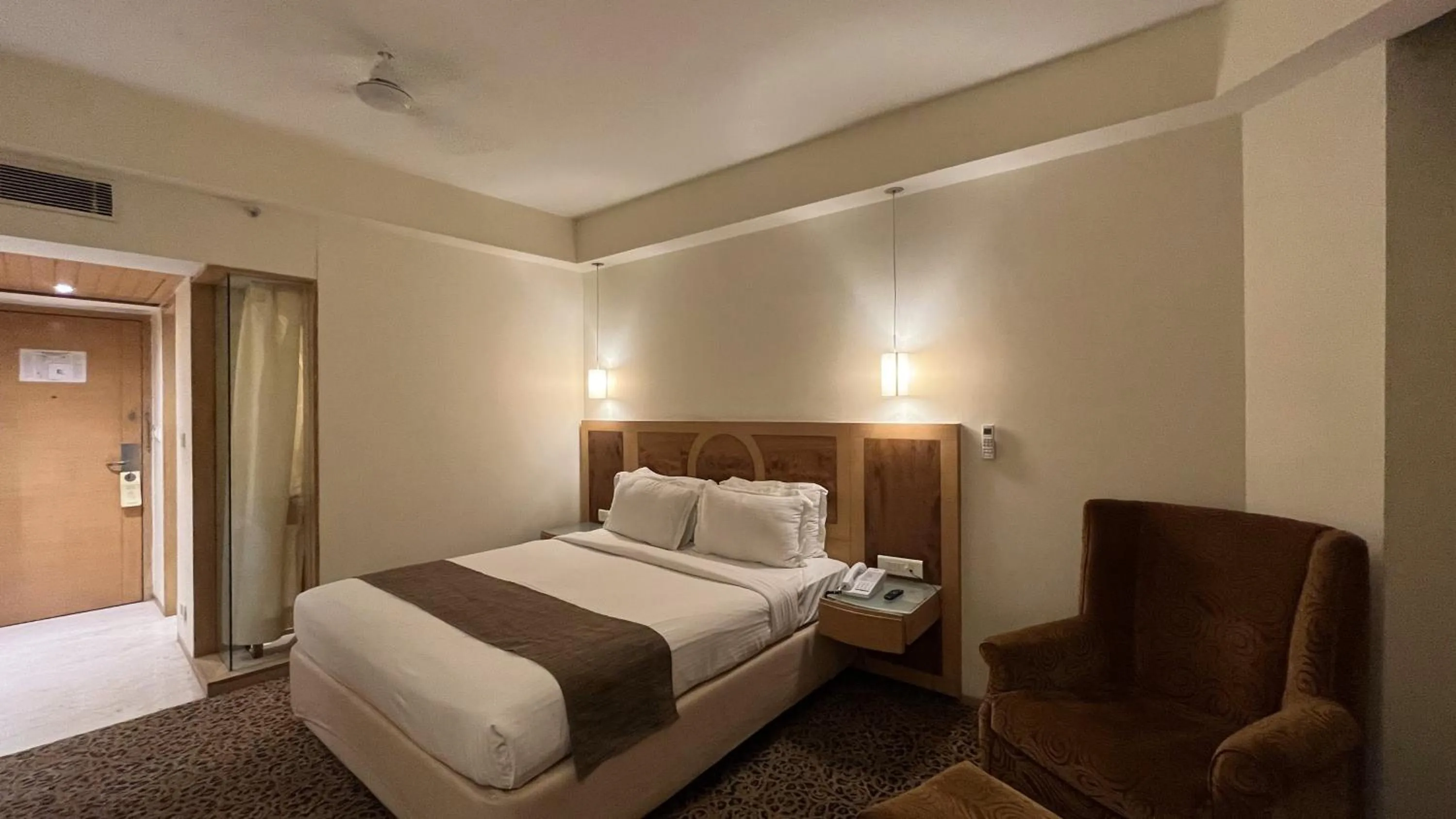 Bed in Katriya Hotel and Tower