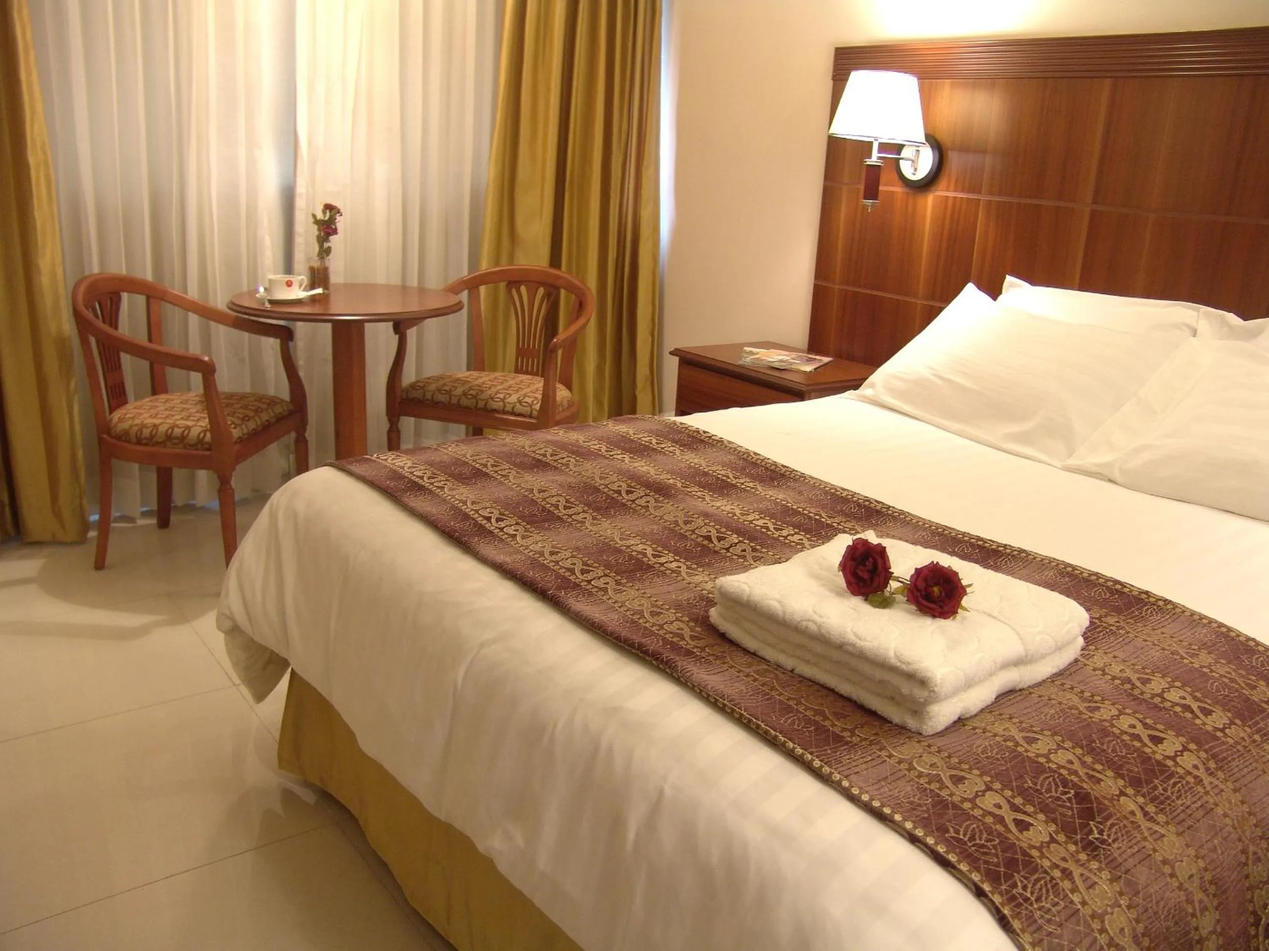 Bed in Katriya Hotel and Tower
