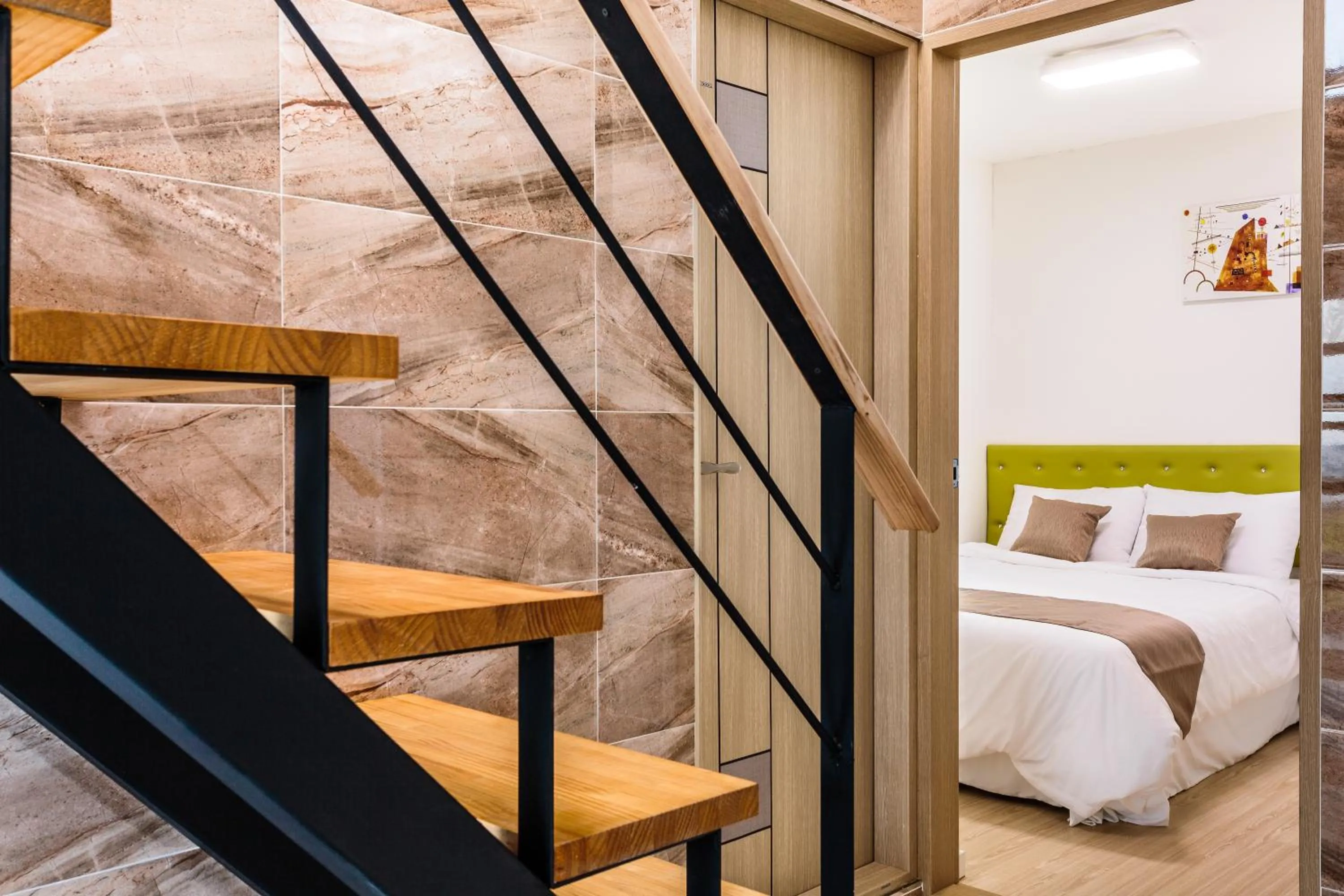 Living room, Bed in Jeju Turning point Pension