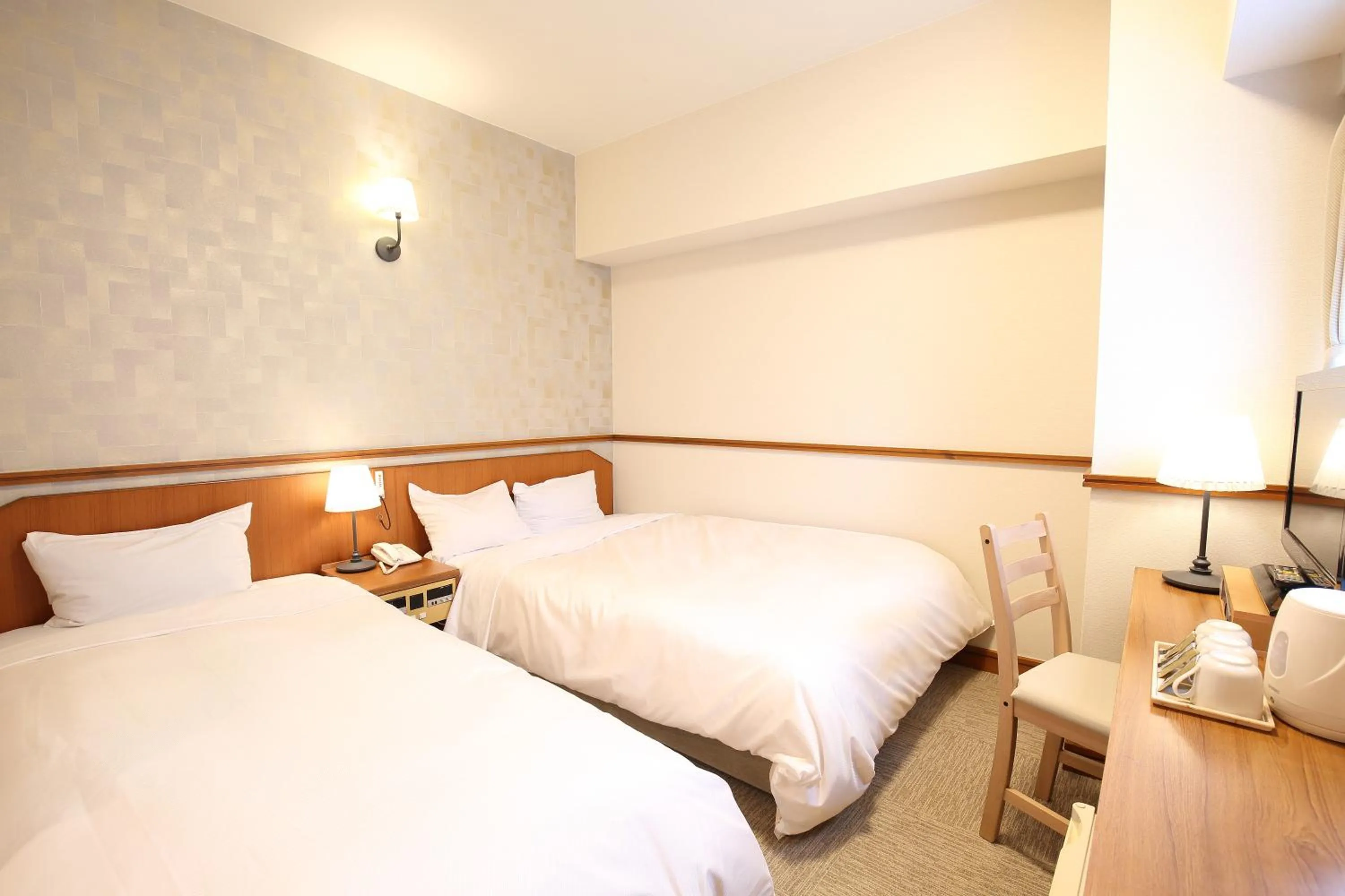 Bed in Hotel Nature Nagoya Sakae Kishu Railway Group