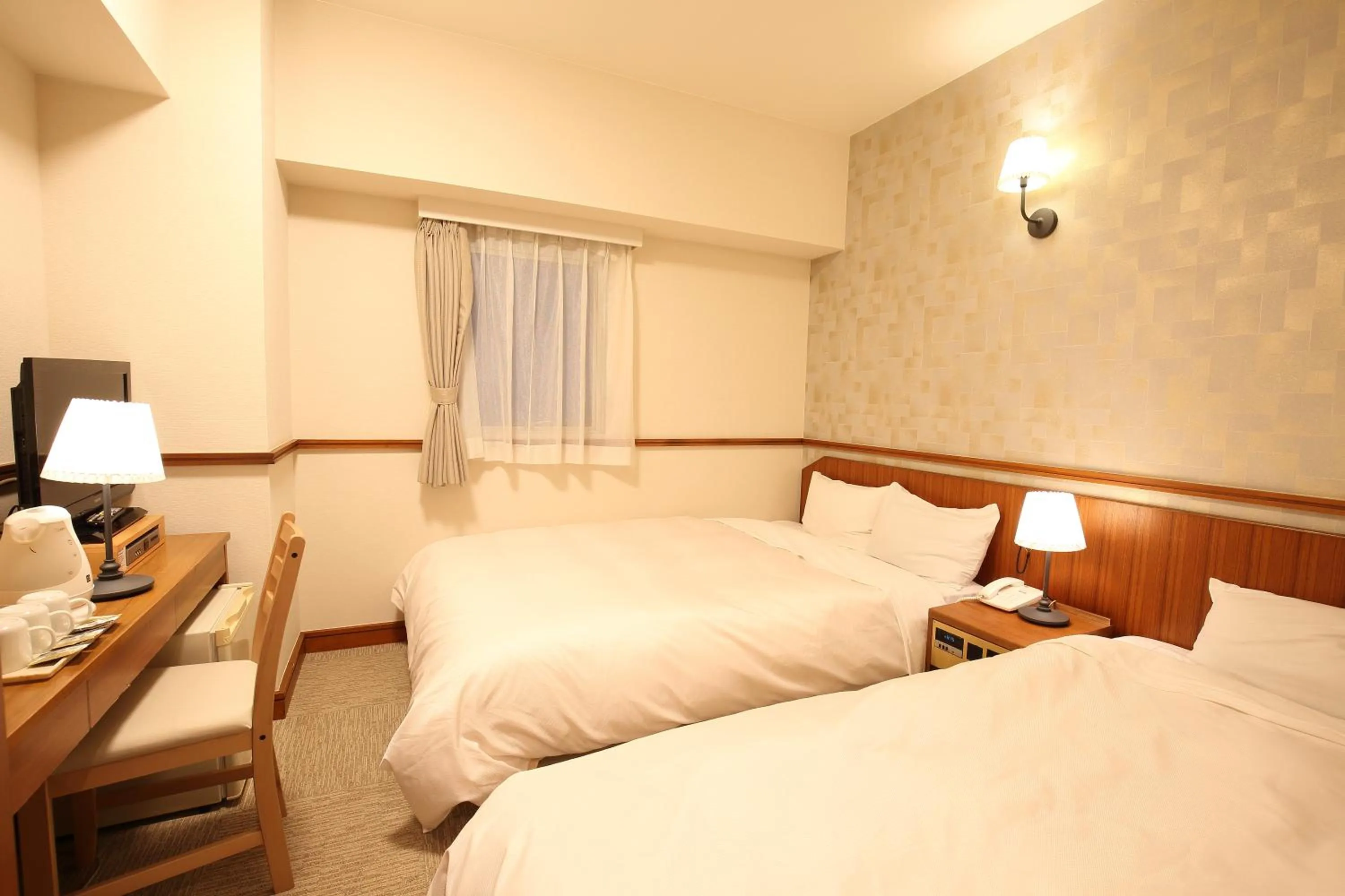 Bed in Hotel Nature Nagoya Sakae Kishu Railway Group