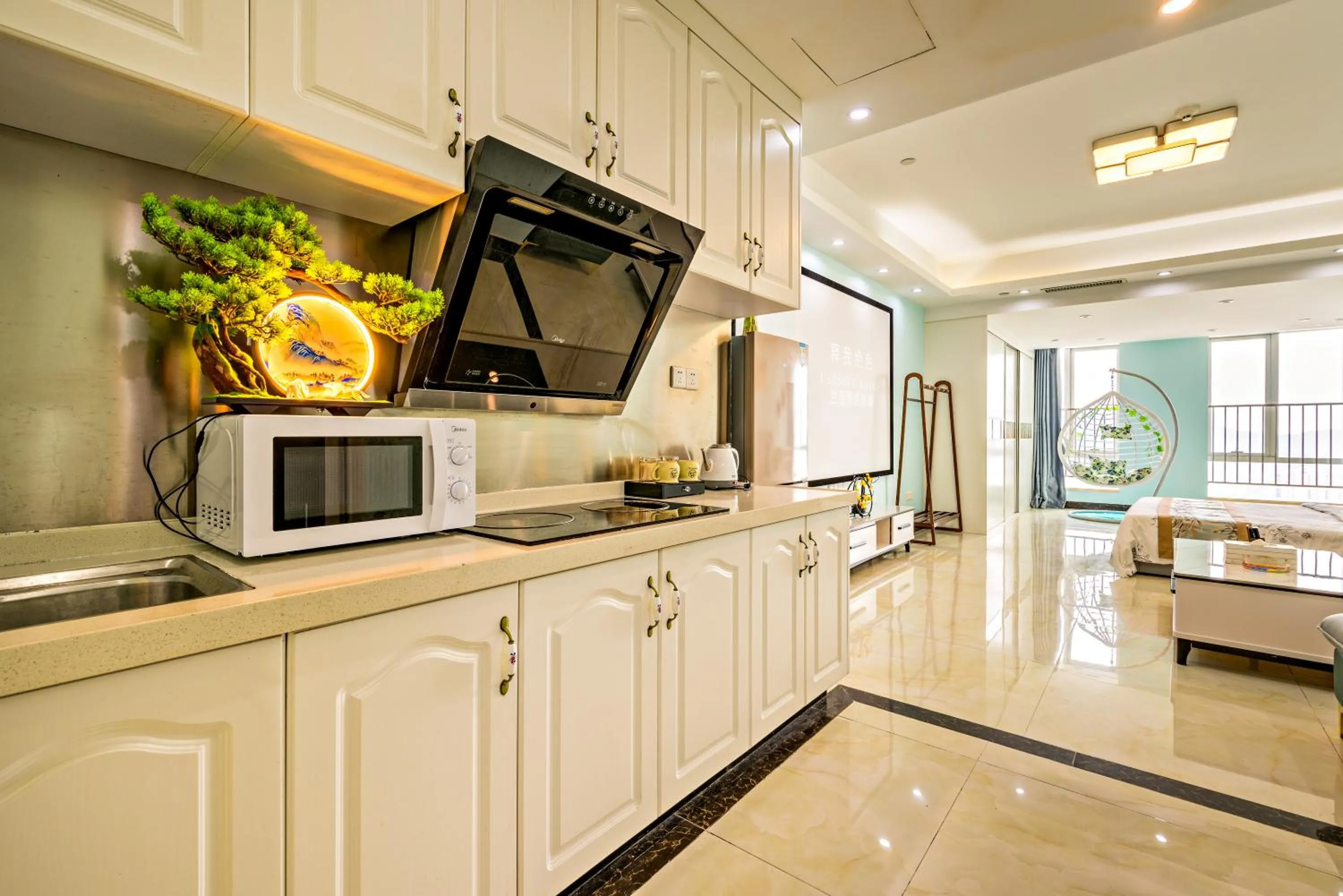 Kitchen or kitchenette in Guangzhou Manhattan International Apartment Zhengjia Free bus services are provided for the first and second phases