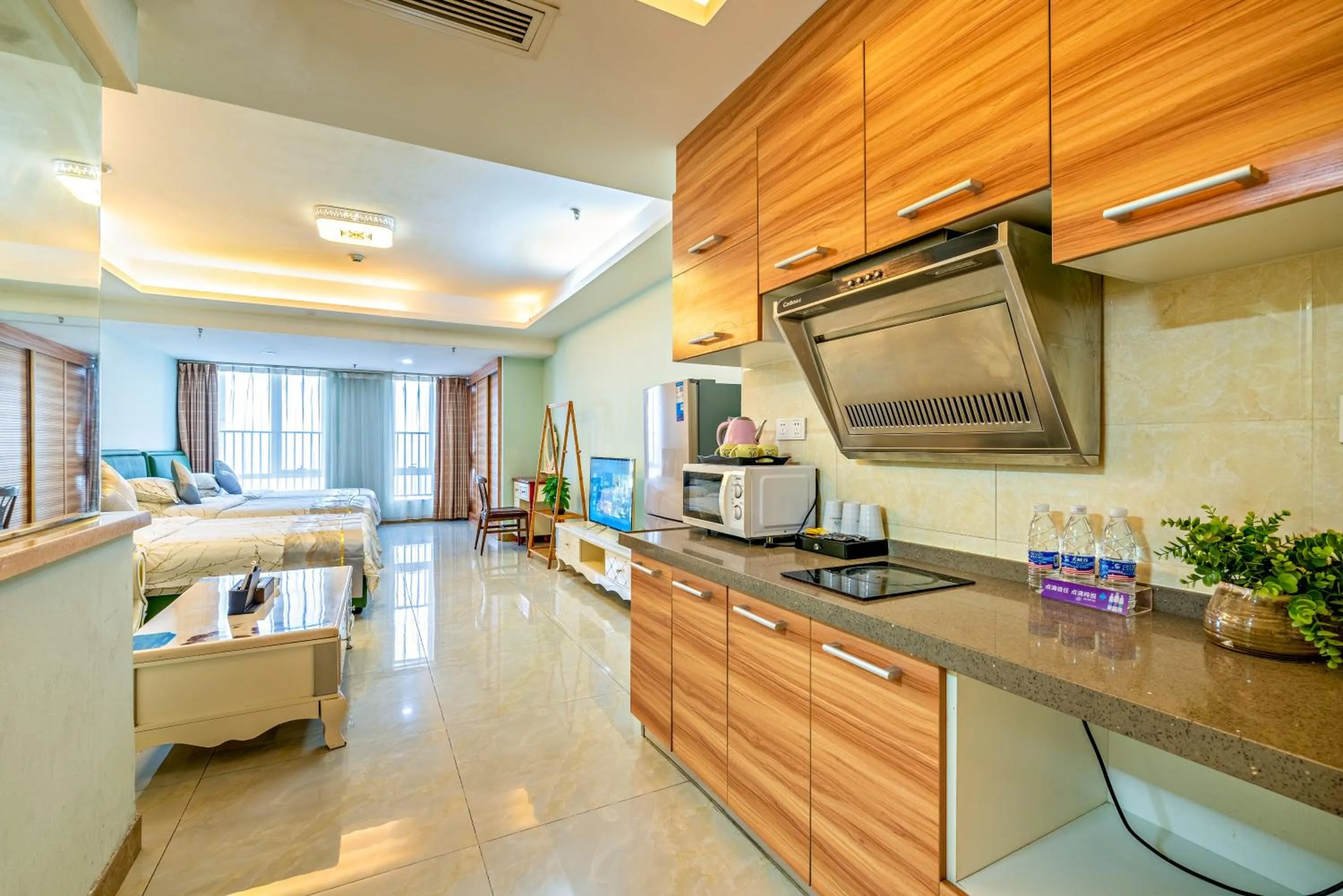 Kitchen or kitchenette in Guangzhou Manhattan International Apartment Zhengjia Free bus services are provided for the first and second phases