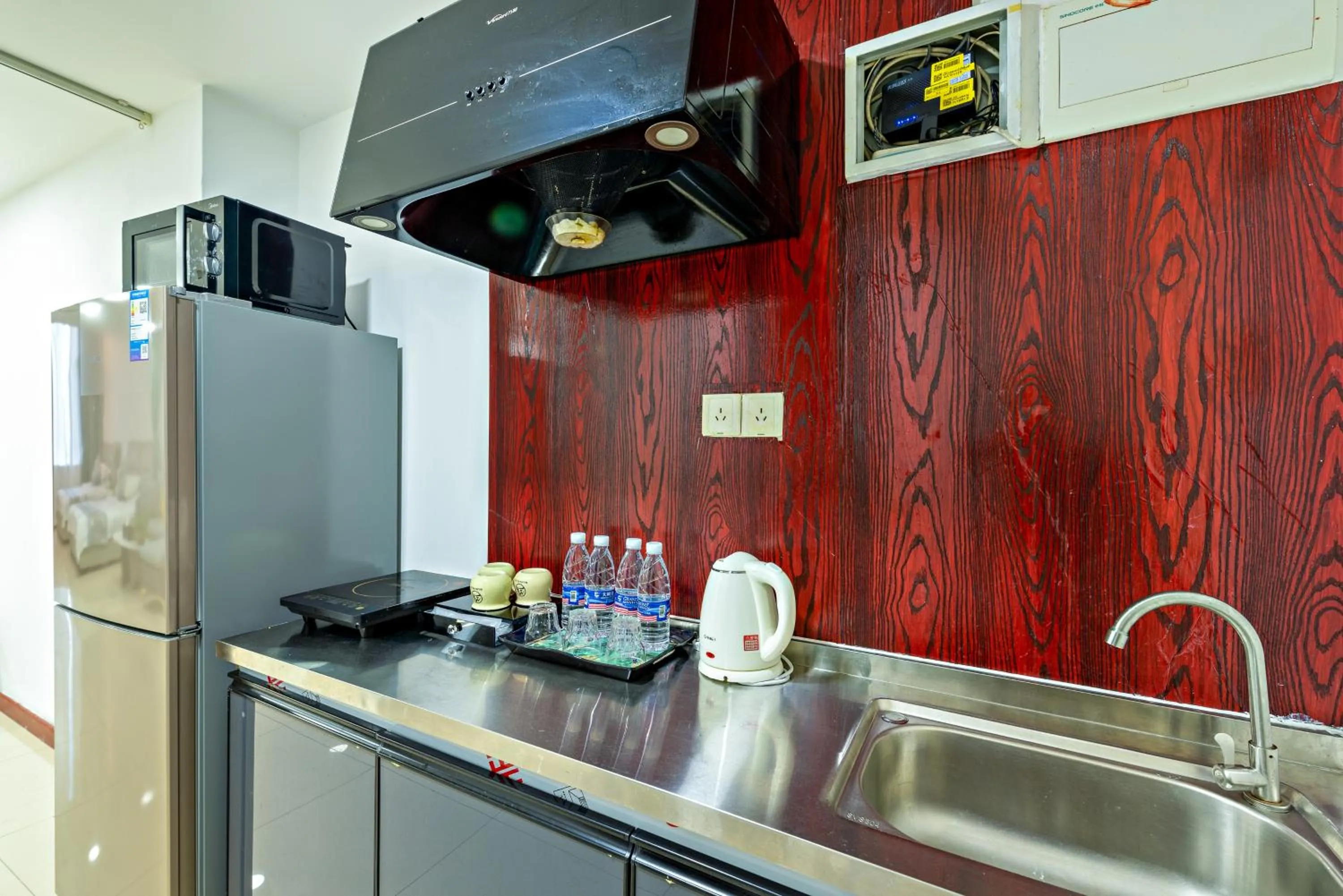 Kitchen or kitchenette in Guangzhou Manhattan International Apartment Zhengjia Free bus services are provided for the first and second phases