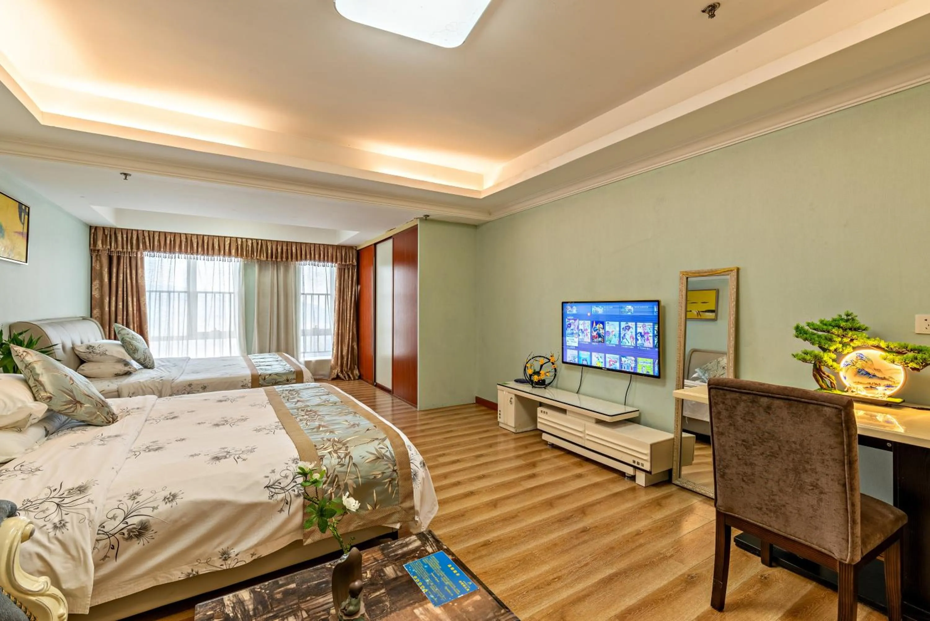 Communal lounge/ TV room, Bed in Guangzhou Manhattan International Apartment Zhengjia Free bus services are provided for the first and second phases