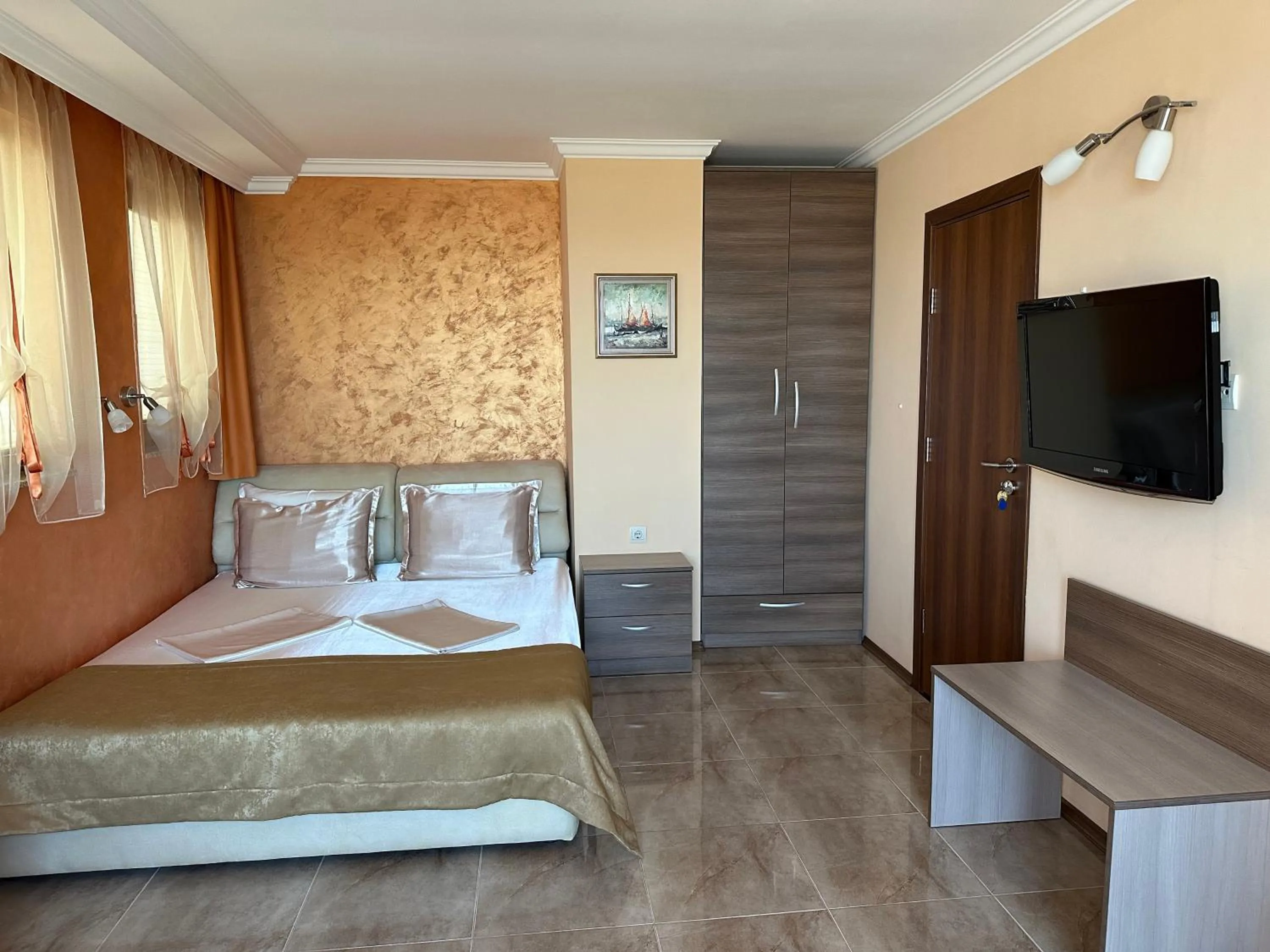 Bed in Family Hotel Radiana