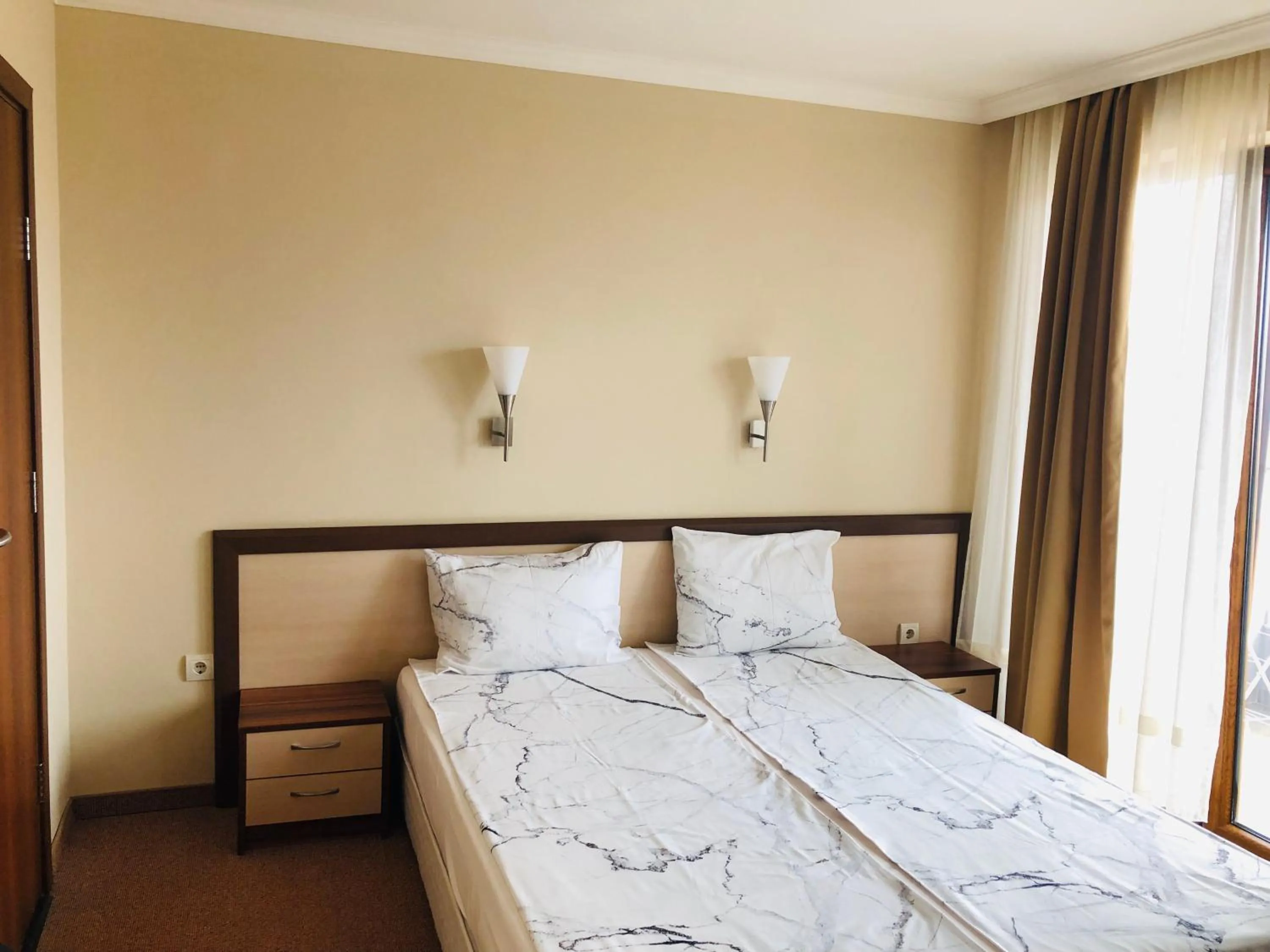 Bed in Family Hotel Radiana