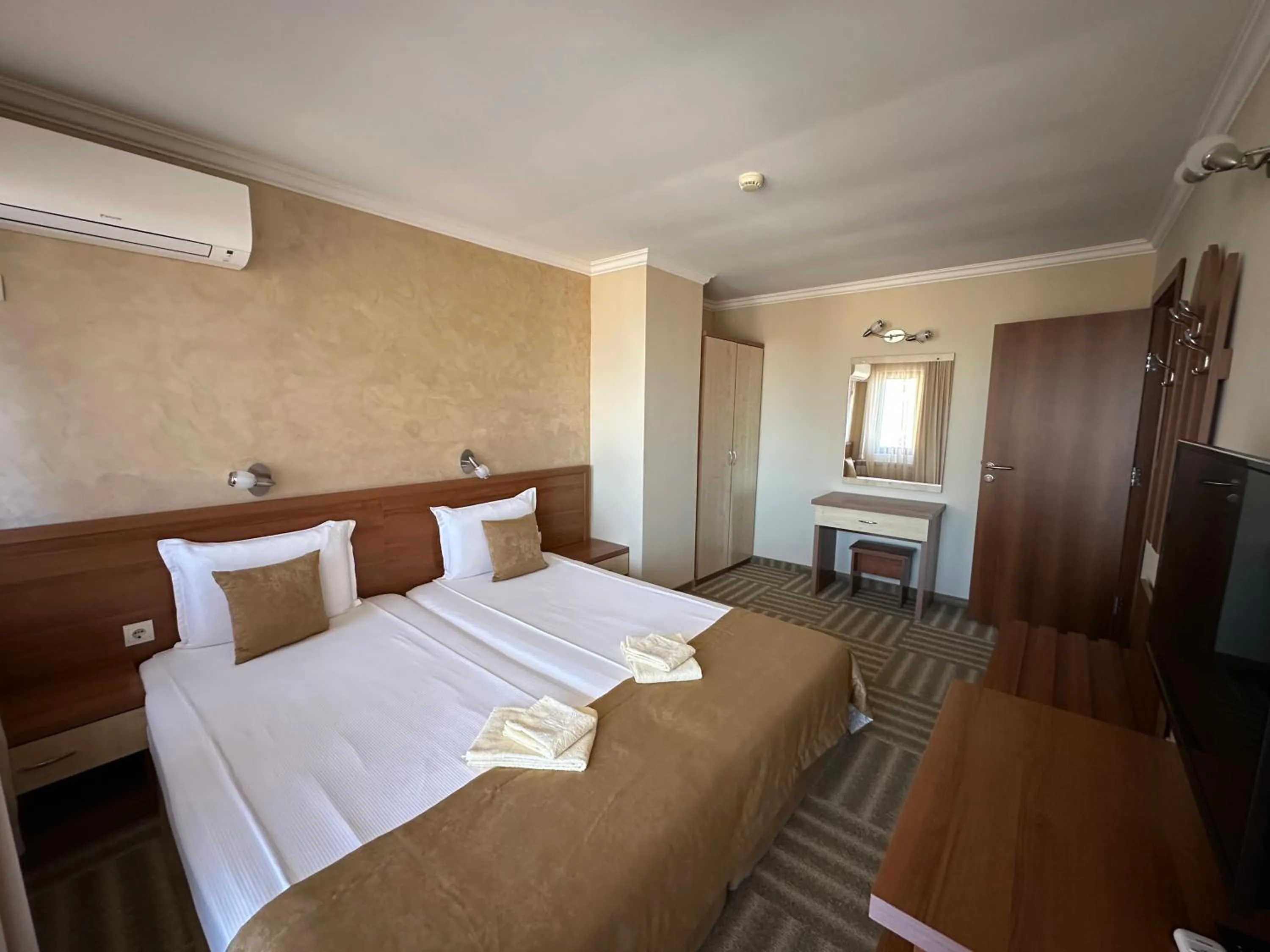 Bed in Family Hotel Radiana