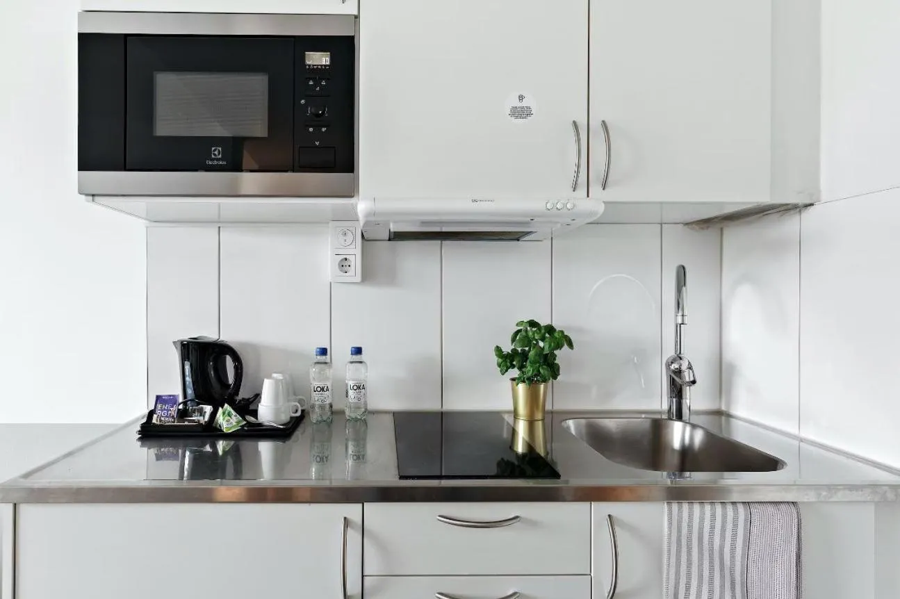 Kitchen or kitchenette in Forenom Hotels & Apartments Stockholm Alvik