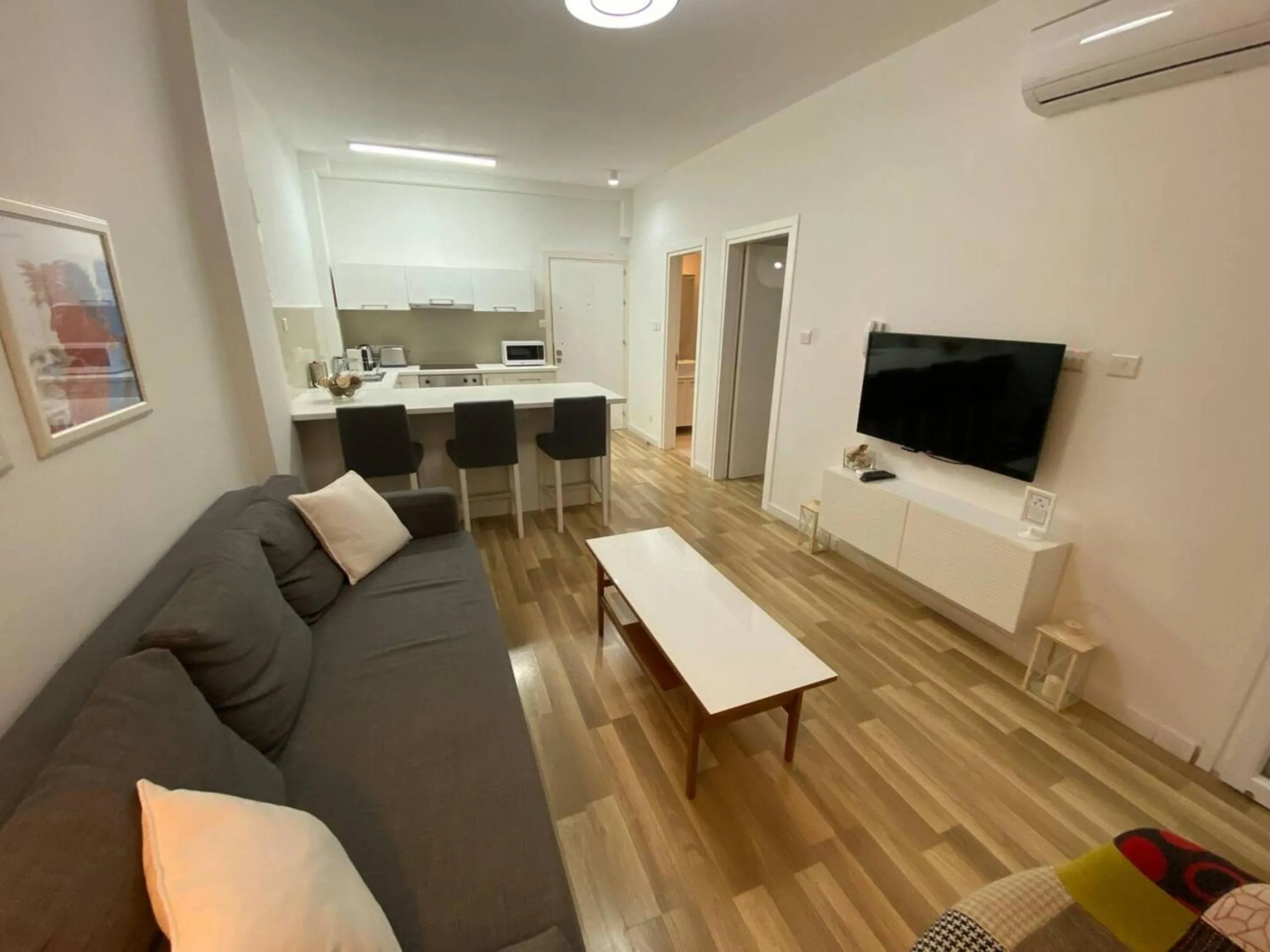 Living room in SeaBreeze City Center Flats by TrulyCyprus