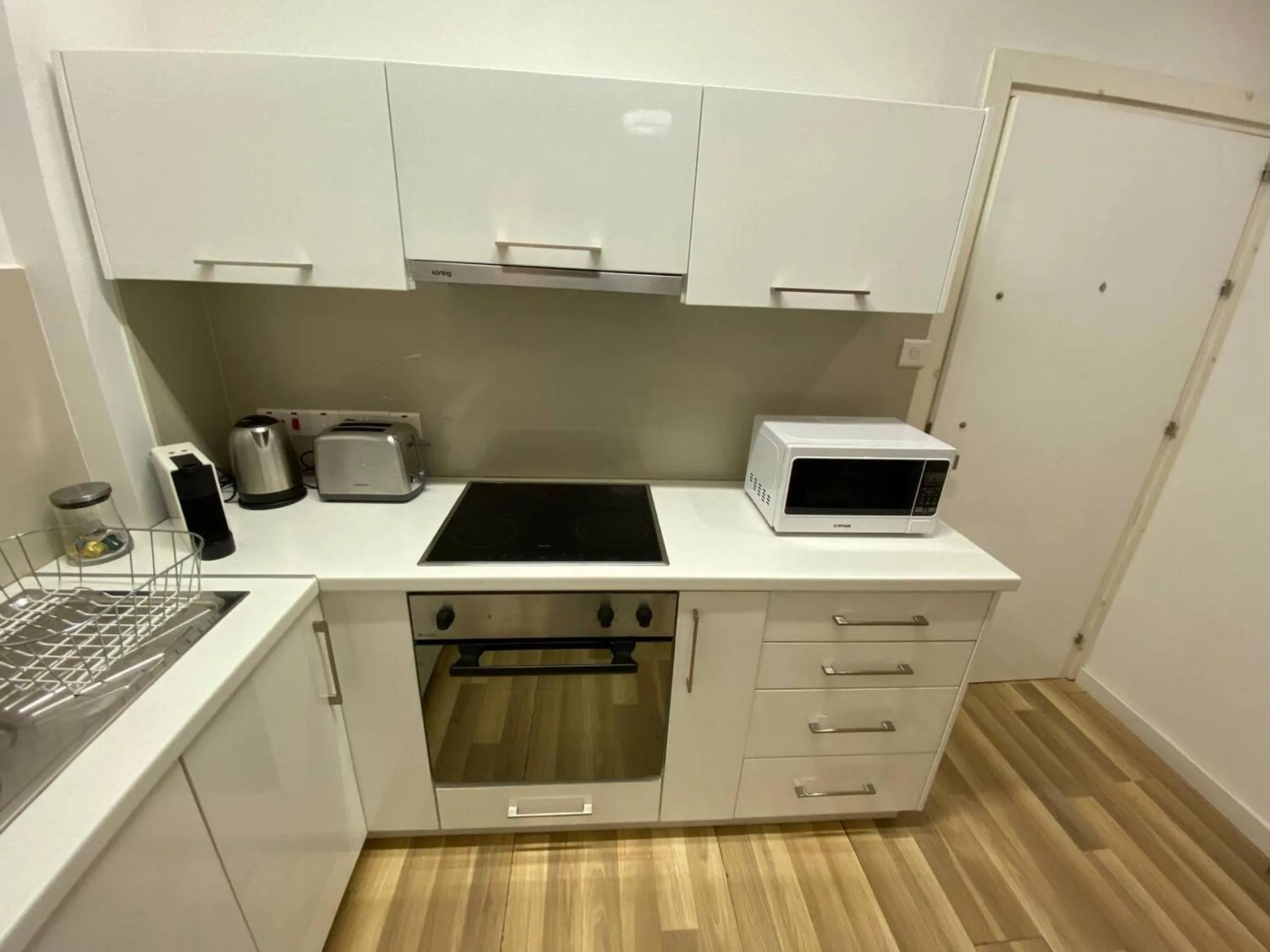 kitchen in SeaBreeze City Center Flats by TrulyCyprus