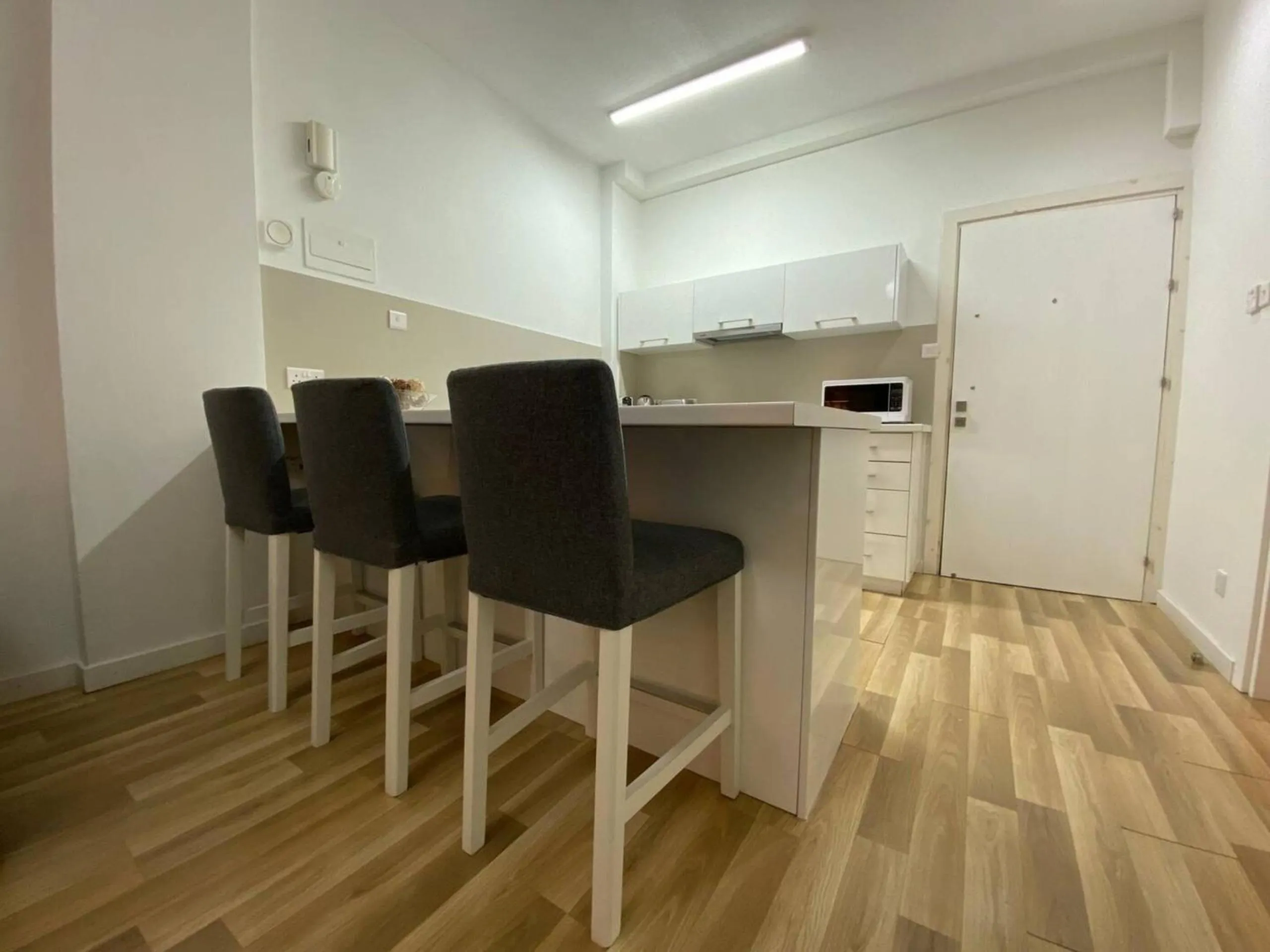 Dining area in SeaBreeze City Center Flats by TrulyCyprus