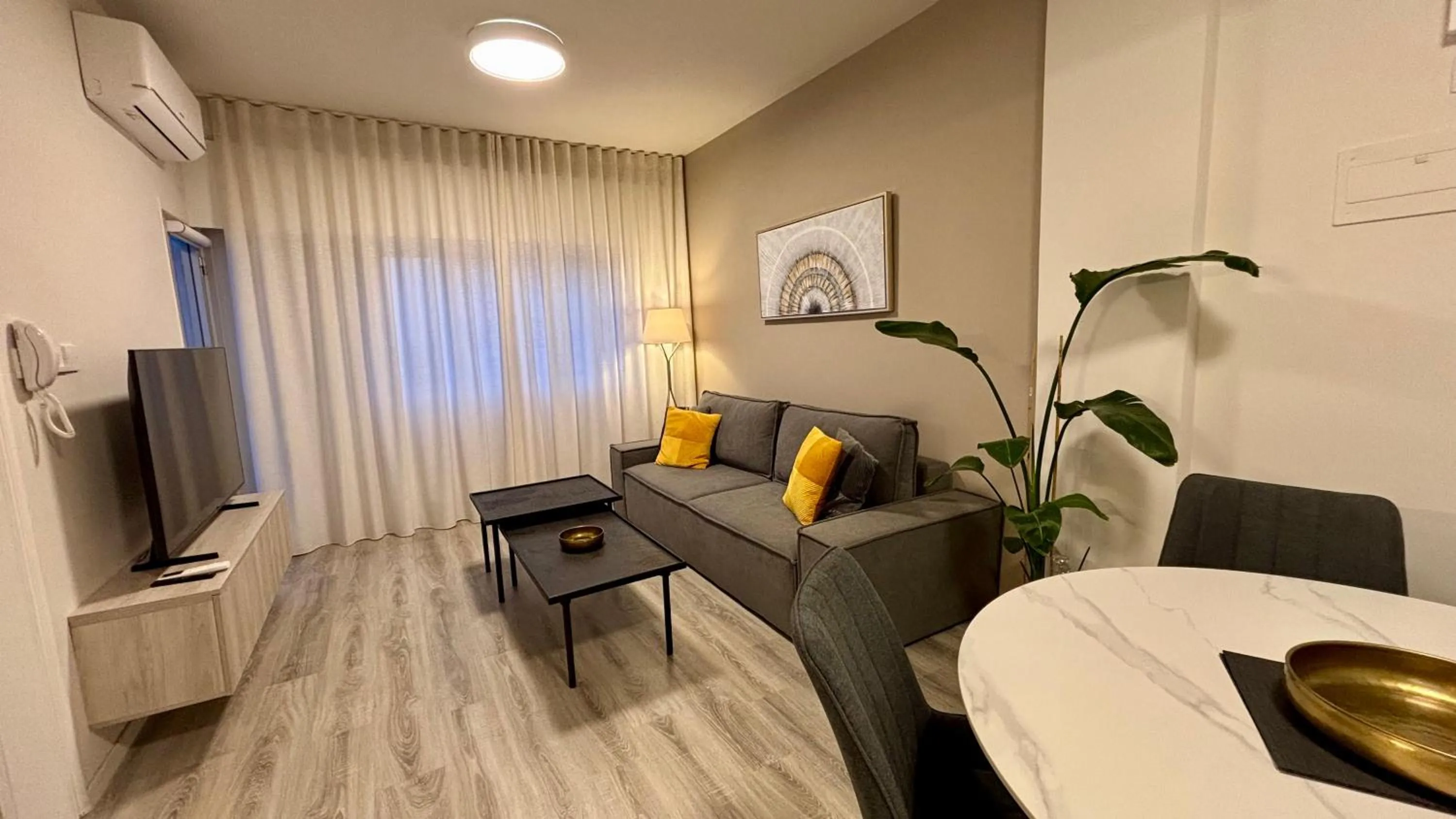 Living room in SeaBreeze City Center Flats by TrulyCyprus