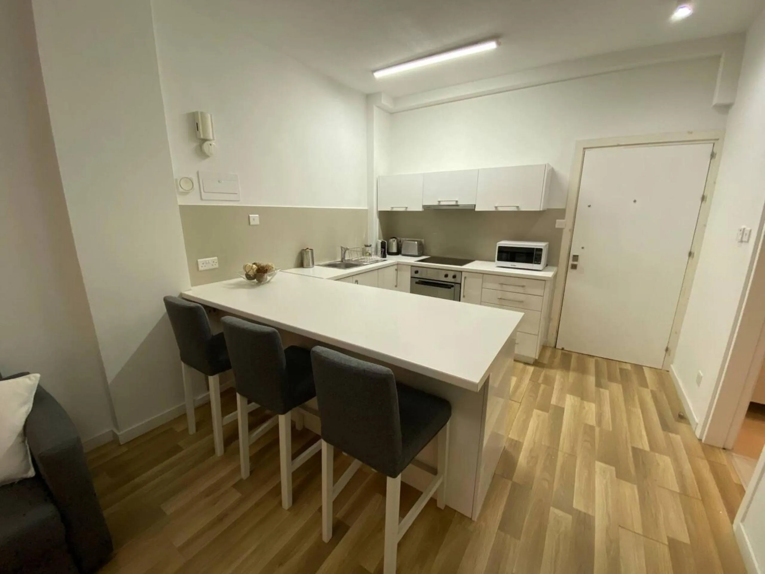 Dining area in SeaBreeze City Center Flats by TrulyCyprus