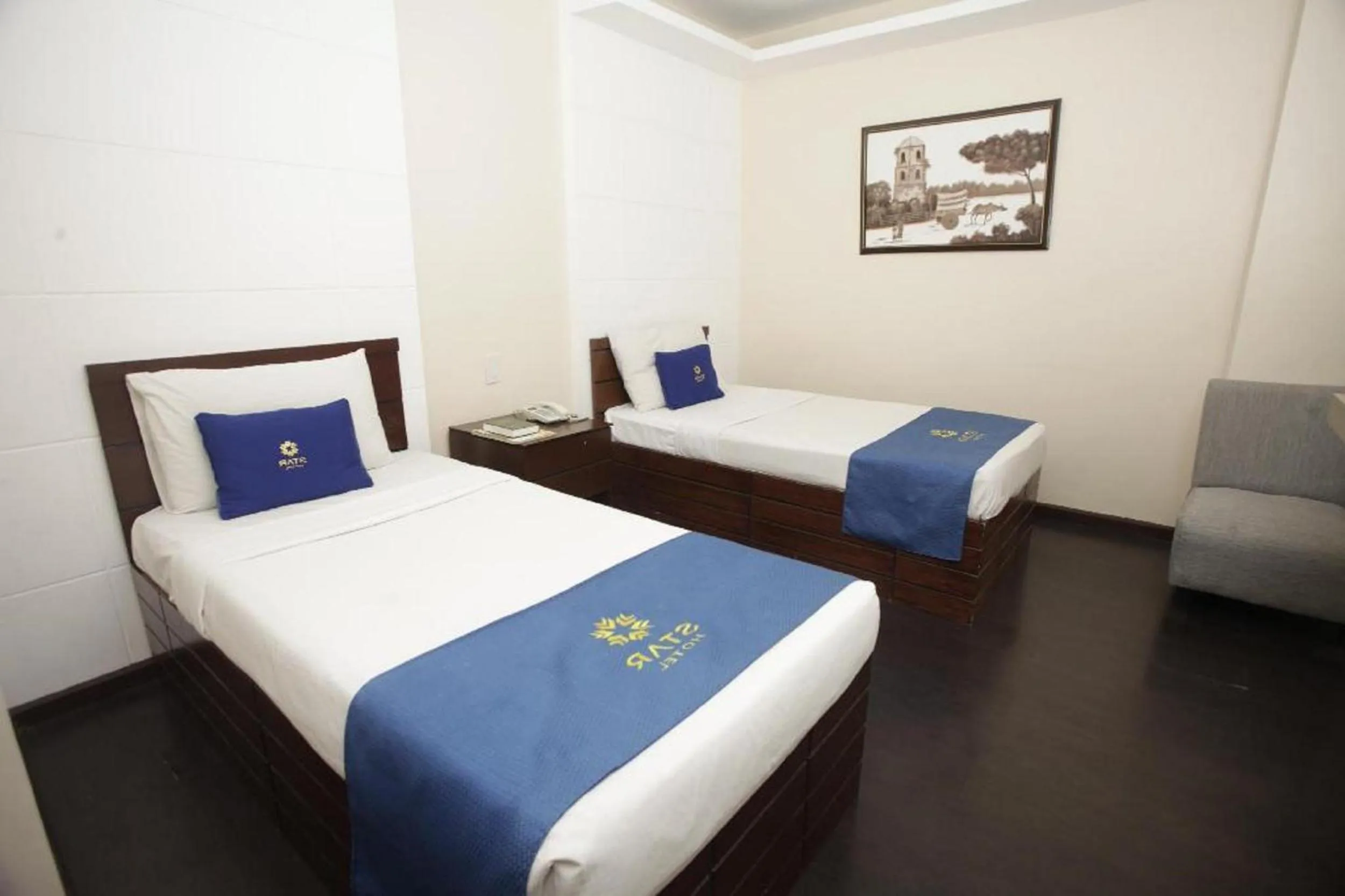 Photo of the whole room, Bed in Star Hotel