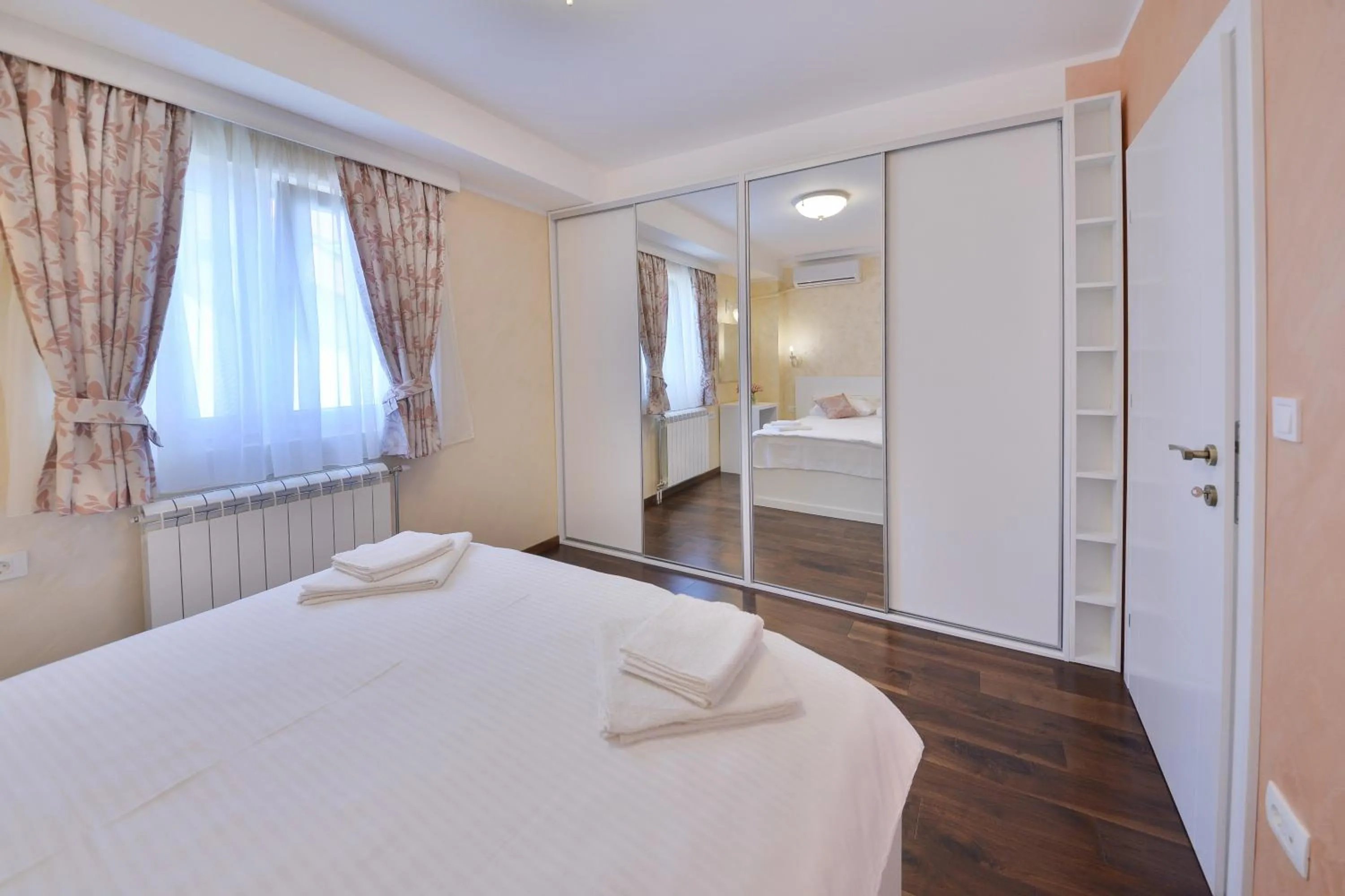 Bed in Aqua Breeze Apartments